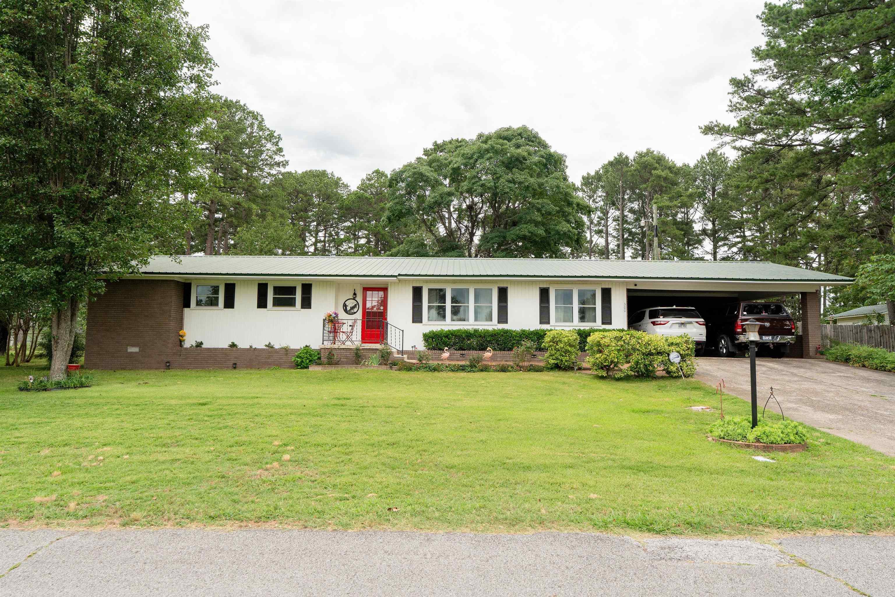 Endless Possibilities on 1.34 acres fully fenced. This well-maintained property offers the perfect combination of comfort, space, and versatility with 3 bedrooms, 2.5 bathrooms, two living areas, a dedicated office, and a formal dining room. Recent updates include new windows, fresh paint throughout, and an on-demand water heater. Stay comfortable year-round with the added warmth and efficiency of a pellet stove. Enjoy relaxing outdoors on the screened porch overlooking the property. Outside, you'll find a huge shop, a garden spot, a 14x20 carport, and a 12x20 RV carport. The 1.34-acre property is fully fenced and offers both commercial and residential zoning, creating endless opportunities for a home business, hobby farm, workshop, or investment. Whether you're looking for room to grow, work from home, or enjoy country living with added flexibility, this unique property is a must-see! Schedule your private showing today.