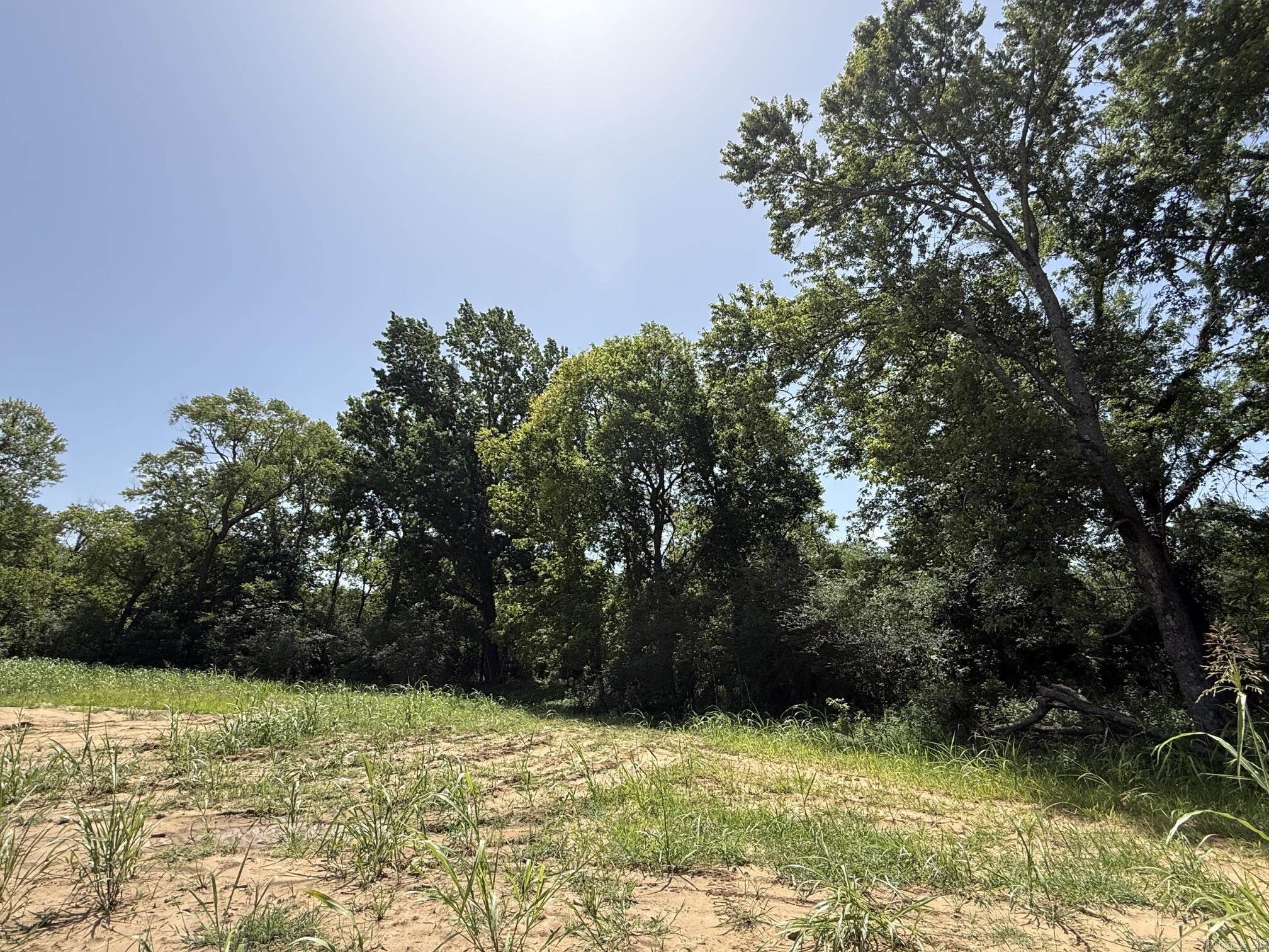 New Development inside the city limits of Heber Springs. River Wood Ranch has flat cleared lots and 19 lots along the river with trees. City sewer and water are available. Boat Ramp and Boat Dock will available by the first of 2027 for use by the residents of the subdivision. There are 8 lots that back up to the lake with views of the lake and Sugarloaf Mountain. Roads are currently gravel but as the lots are developed the roads will be paved.
