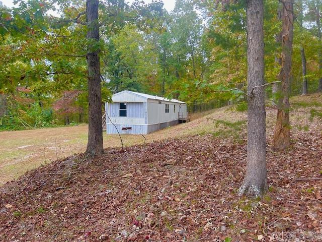 Newley renovated 2BR/2BA home on 4.5 peaceful acres just past Pine Hills Golf Course and minutes from downtown Mountain View—the Folk Music Capital of the World! Nearly move-in ready, this property includes two additional home pads with power, water, and septic—ideal for extra homes, rentals, or RV spots for friends and family. With three parcels and three addresses, the possibilities are endless! Enjoy privacy down a wooded driveway surrounded by deer and wildlife, all just minutes from the famous White River. Perfect for a full-time residence, getaway, or investment opportunity! Pictures of inside home will be added shortly. It is still being worked on. Call today to see it for yourself.