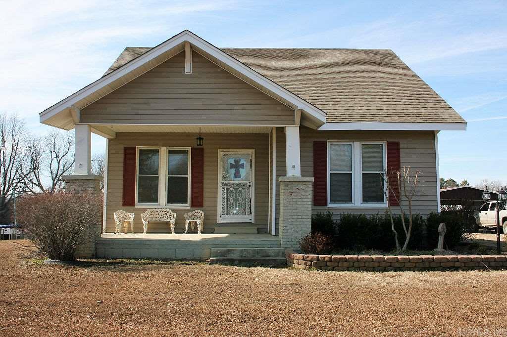 5 Acres in the city limits!! This home has been updated throughout. It has a large kitchen with lots of storage. The master bath has had recent updates including paint. Carpet was replaced in Feb 2018. Outside you will find a stocked pond, fenced and cross fenced acreage, and storage area. There is a well on site that supplies the pond. This house comes with a security system in place and will remain with the house.