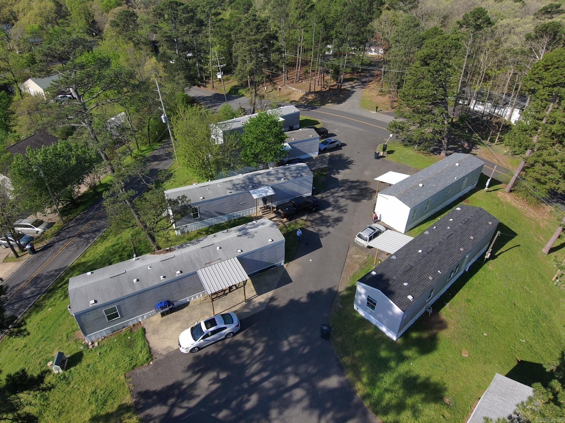 Mobile Home Park for sale, 2 blocks from Walmart, just minutes from the lake. This would make a great investment for your portfolio, 16 units on site year models are 2005 and newer. rent is ranging from $ 875 up to $1000 on occupied units at this time.   Great neighborhood to invest in.  TONS of potential with this Park!   Drive by and take a look at the park and the neighborhood and see if this is something for you!  Would make great AIR B&B or monthly rentals.  Seller has done several repairs to units. 15 units are under yearly lease at this time.  $13,625 is coming in monthly on the 15 rented units. All units are parked owned. Update** should be 100% occupied in June. Seller has spent the last 12 months updating and doing repairs to bring this park back to life. Most all of the units were empty last MAY 2025 and needed to be refurbed. He has worked very hard over the last year and now has them rented and ready for an owner to come in and keep it growing.                !!!!!!**** READ AGENT REMARKS PLEASE. ****!!!!!!
