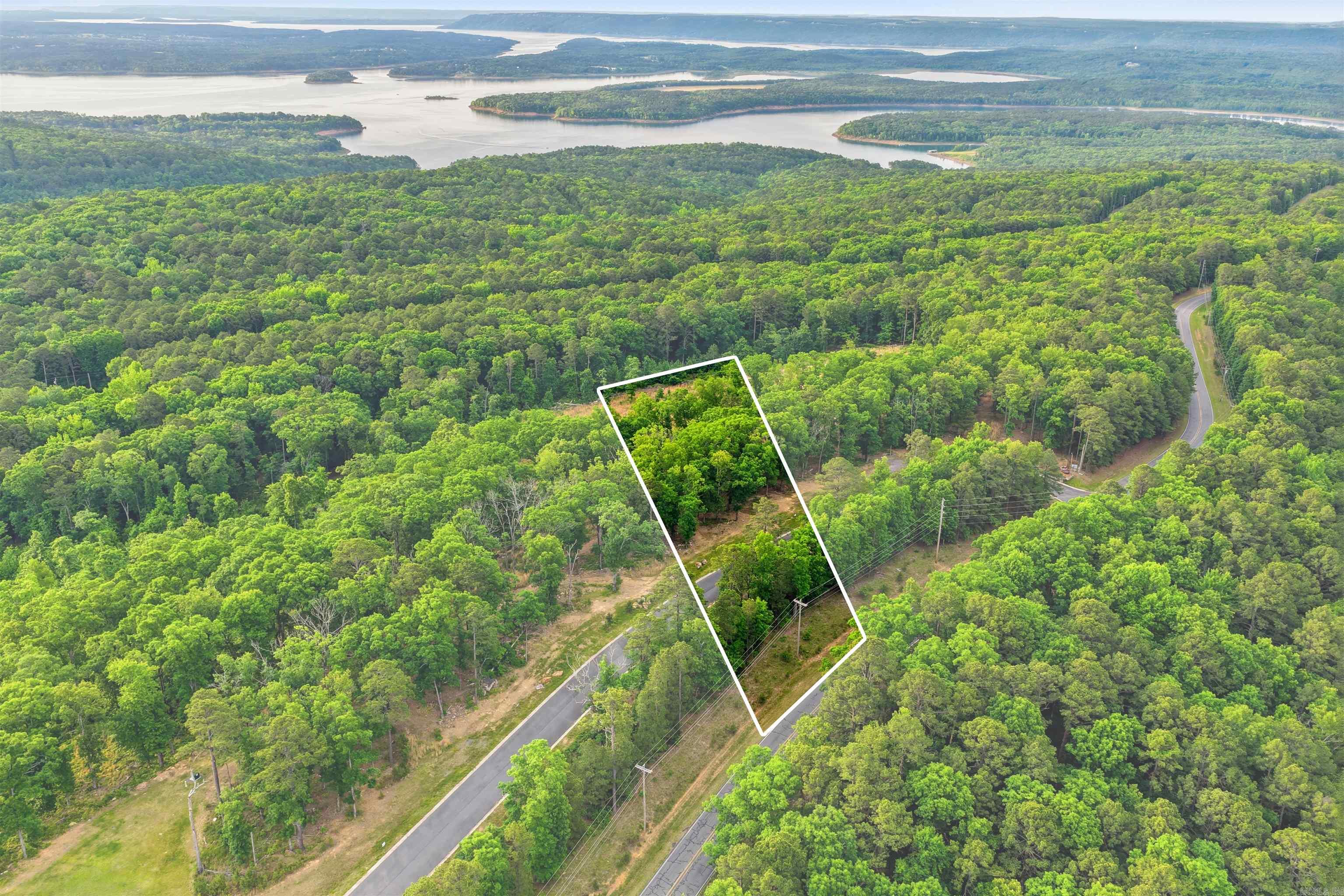 Looking to build your dream home or weekend lake getaway? Look no further, this is the perfect lot for you in the Osage point subdivision! The view of Greers ferry lake is enough to steal the show but there is also 2 separate lots here. One for the main home and across the street for your large garage or shop! Survey and restrictions are on file. Schedule your time to take the peaceful drive to beautiful Fairfield Bay!