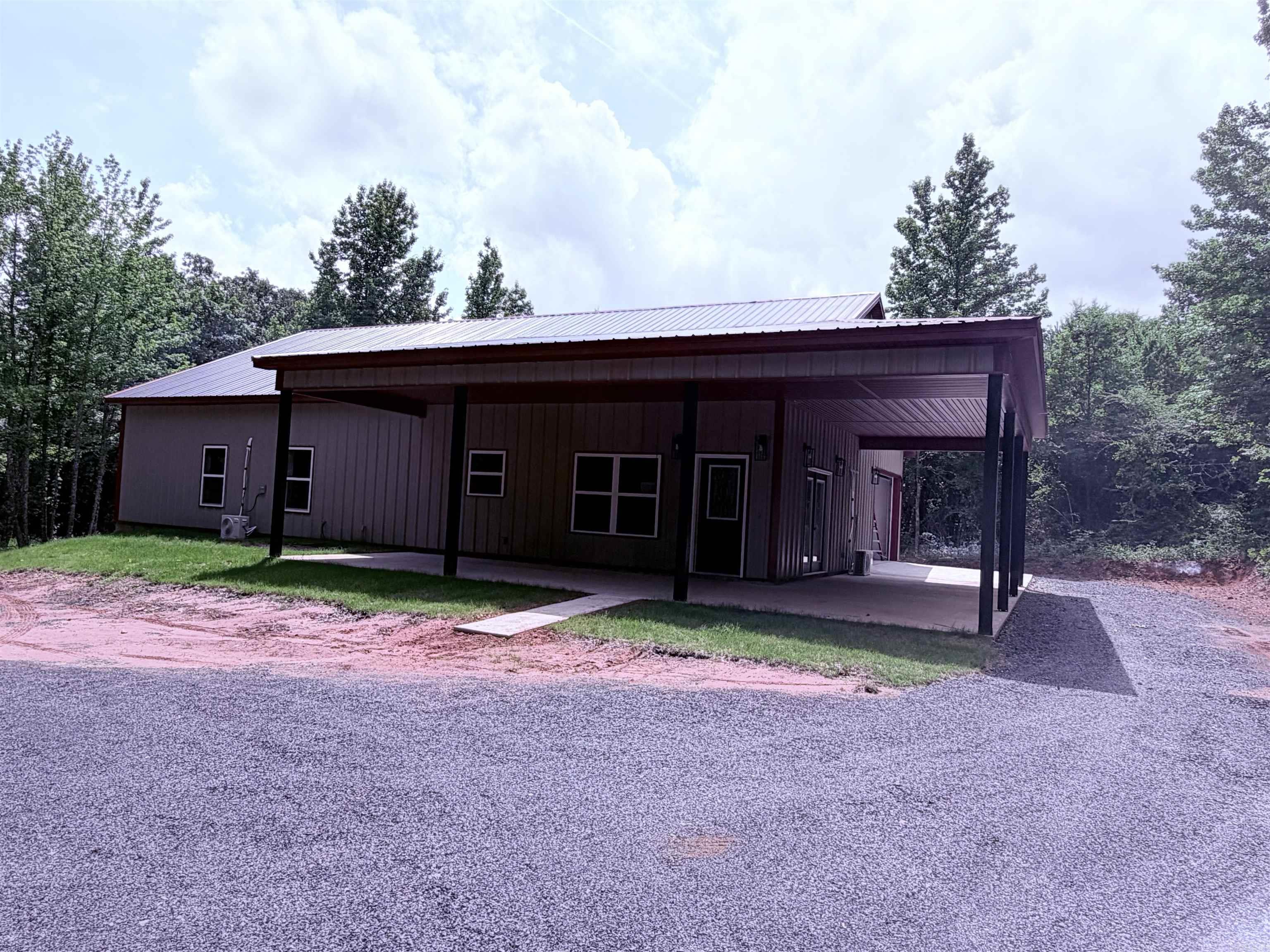 Are you looking for "Barndominium" house w/4BR/2BA on 2.0 acres on country setting? Property offers: 2x6 walls, foam insulation throughout the house, open floor plan, 16ft vaulted ceiling in Living Room with recessed lights, Mini Splits, electric fireplace, electric tankless water heater, granite countertops, moveable island, large Walk-In pantry, UV Filtration System for Well Water, 328sf garage side-load garage with concrete driveway, covered back porch deck 12x12, property located in back with circular driveway and gutters to be installed soon. Agents see Remarks.