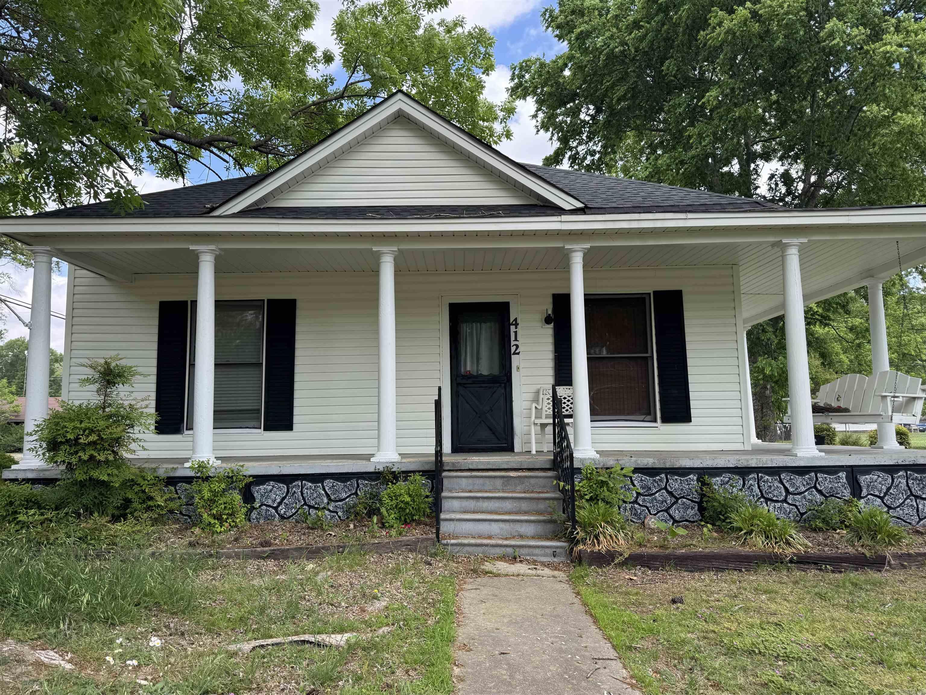 Charming 1960's home located within the city limits of a welcoming small town known for its excellent school system. This spacious 3-bedroom, 2-bath residence offers timeless character paired with key modern updates, including a newer roof and HVAC  for peace of mind. Situated on a desirable corner lot, the property features a large wrap-around porch-perfect for morning coffee or evening gatherings-surrounded by mature shade trees that provide beauty and comfort year-around. With generous outdoor space and classic appeal, this home offers the perfect blend of small-town charm and everyday convenience.