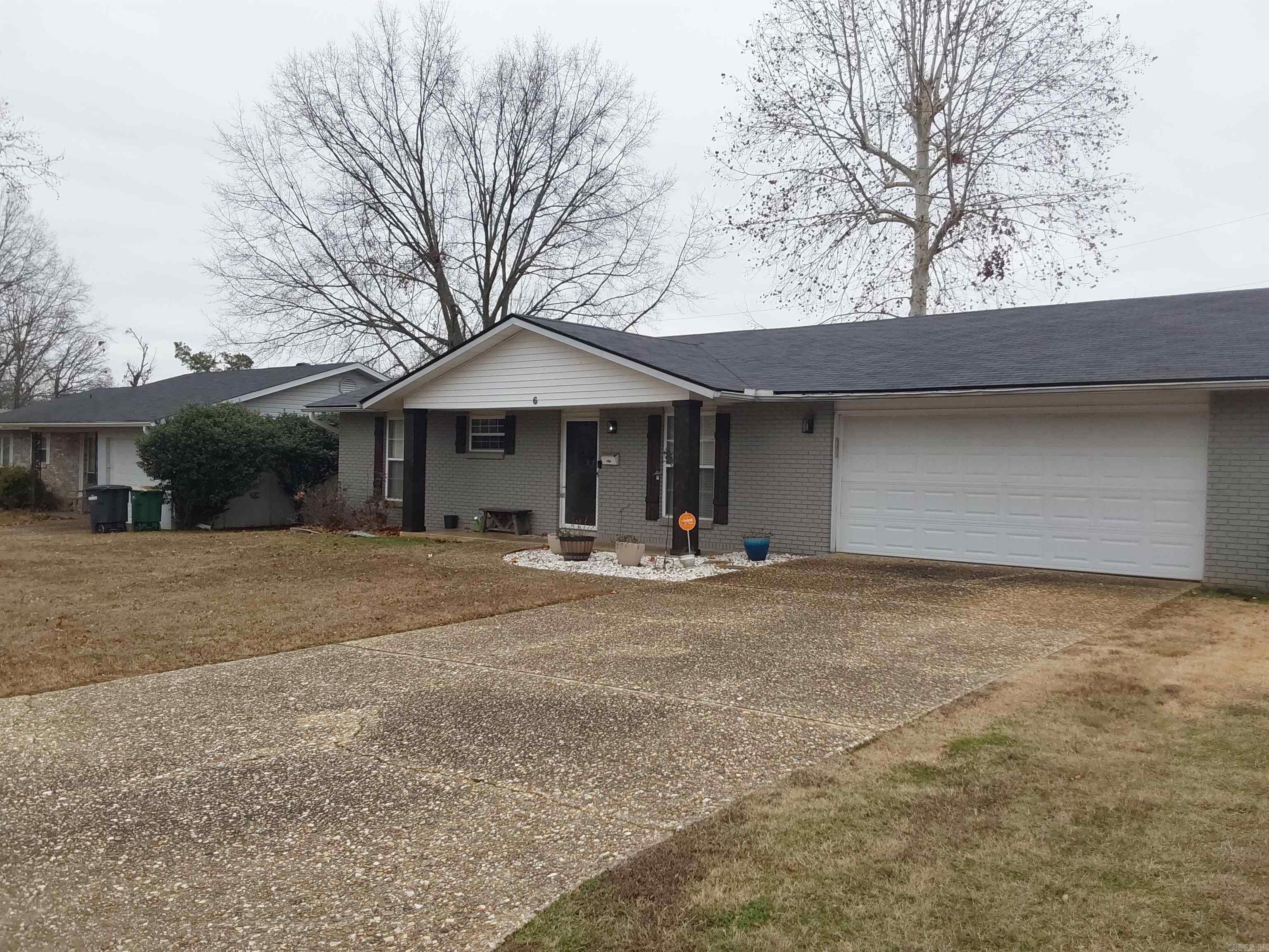 Check out this super cute home! Painted brick with stained cedar shutters and stained cedar posts. This home features three spacious bedrooms, two full baths, a wood burning fireplace, a great kitchen with with new granite and newly painted cabinets. Nice flooring throughout the home, carpet in the bedrooms. Great fenced in backyard with a large storage building. Fantastic amenities also include a new roof in 2023, gutters, and a two car garage. Come check out this great house! It won't last long!