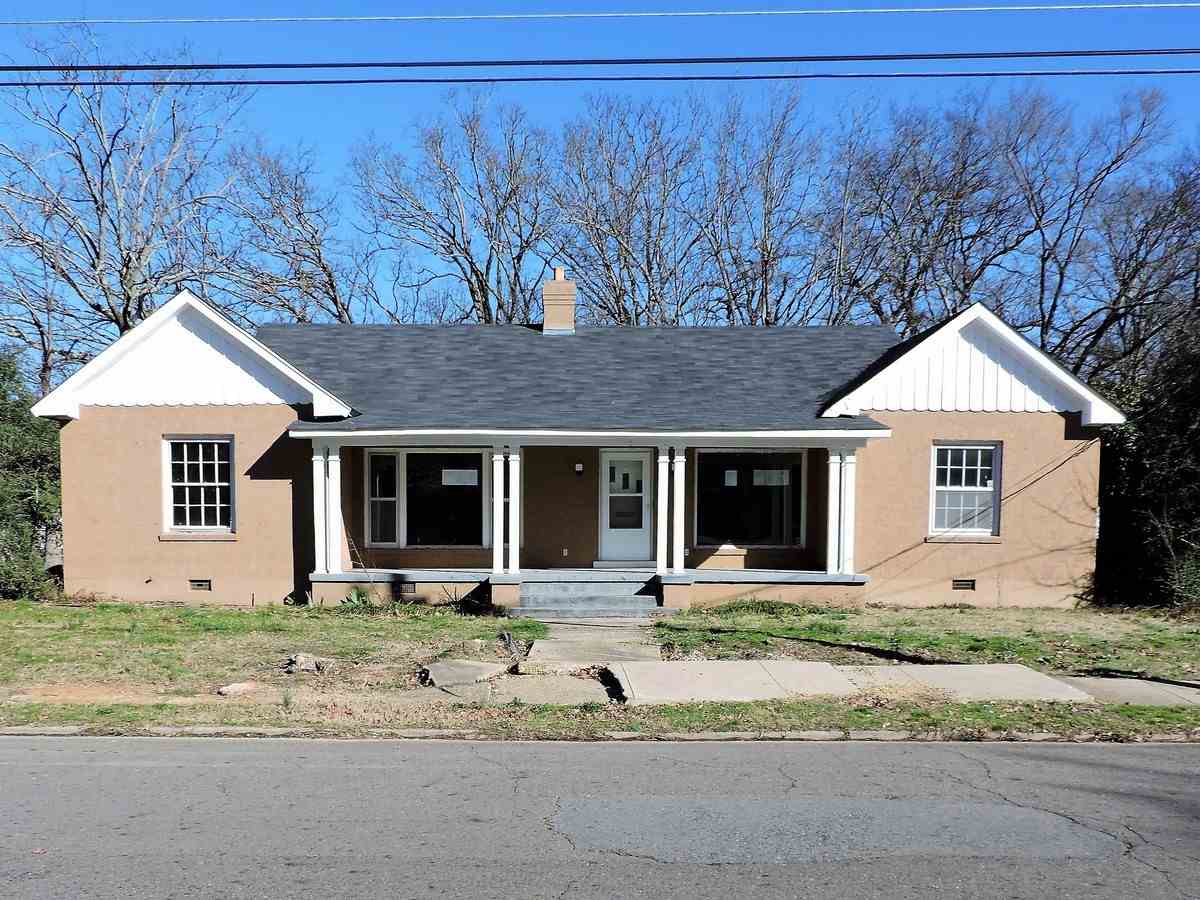 One level brick ranch style home set on a level corner lot conveniently located within the city of Hot Springs. Home features 4 bedrooms, 2 full bathrooms, central heat, fireplace, front porch, rear deck, attached 2 car carport, detached 2 car garage and level partially fence backyard. (See Agent Remarks)