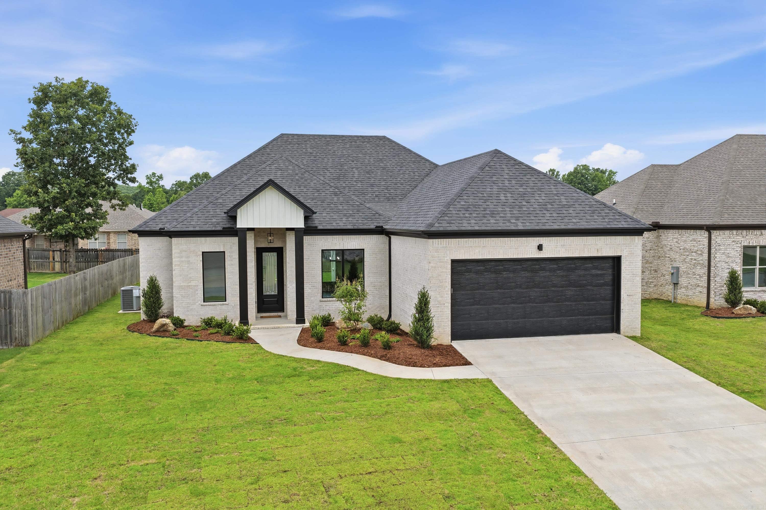 This impressive all brick new construction located in Kenwood Estates was just completed!  Enjoy the open floor plan with 11-foot ceilings in the entry way and living areas.  There's an open and airy feel throughout with stunning hardwood floors and LED Fireplace that can be used rear round.  The light filled great room and dining room flows seamlessly into the well-designed kitchen that's complete with a large walk-in pantry.  Work from home in the dedicated office that offers flexibility and everyday living.  The oversized primary suite has hardwood flooring and a spa like bathroom with a tub and separate shower.  Quartz countertops are in the kitchen, bathroom and laundry rooms.  Enjoy outdoor living on the spacious covered patio and ceiling fan.  There is a no maintenance all brick exterior complete with lawn sprinklers and guttering.  This home blends quality craftsmanship by a builder with over 30 years' experience.  You will love the thoughtful design and attention to detail!