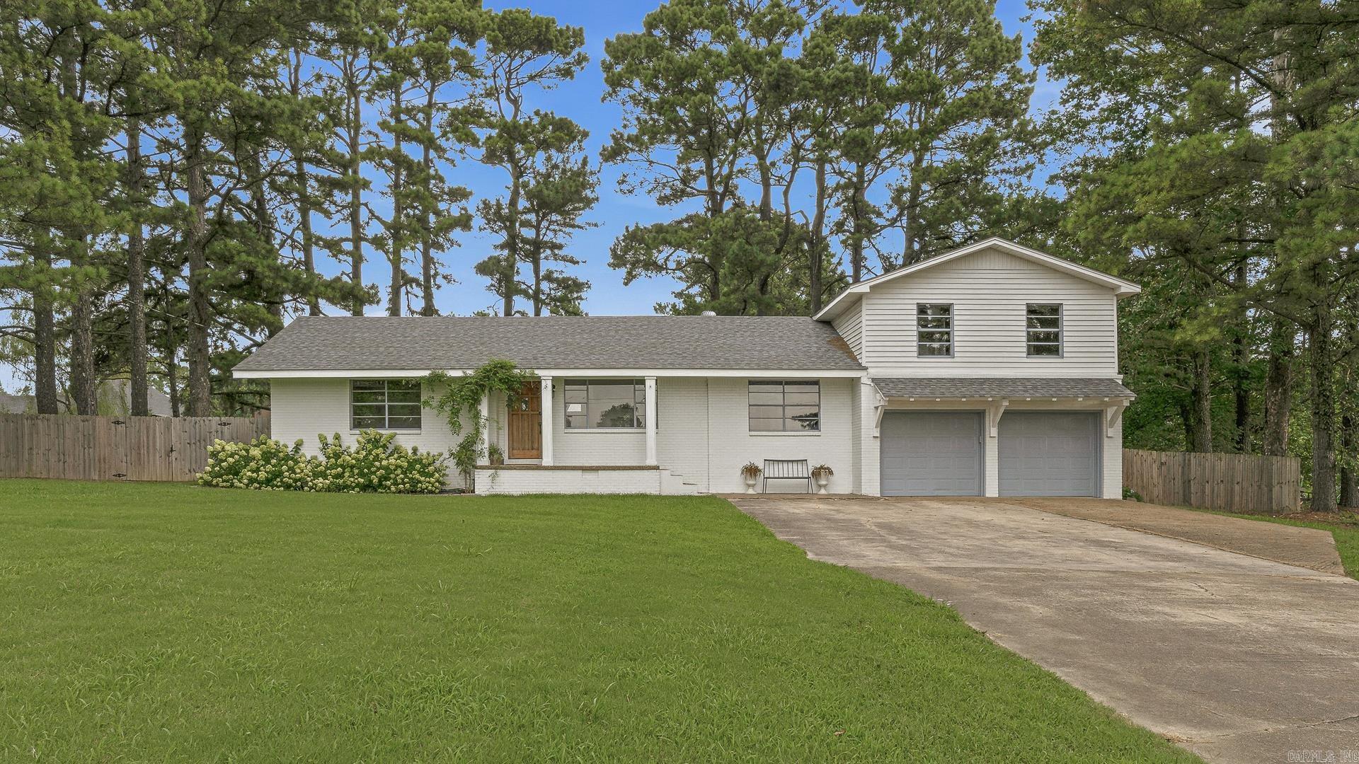 Welcome home to peaceful country living! Nestled on approximately 0.81 acres in the highly desirable Brookland School District, this beautifully updated home offers 4 bedrooms, 2 bathrooms, and the perfect blend of charm and modern convenience. Extensively remodeled within the past five years, this home features major updates including a new roof, HVAC system, septic system, electrical, and plumbing giving you peace of mind for years to come. Full of character, this home features original exposed brick walls, sliding barn doors, and charming details throughout. The spacious primary suite is privately situated on the main level, creating a peaceful retreat complete with a cozy wood-burning fireplace the perfect place to unwind at the end of the day. Three additional bedrooms upstairs provide plenty of space for family, guests, or a home office. Step outside to enjoy the large back deck overlooking the beautifully shaded backyard. Gardening enthusiasts will appreciate the fenced garden area and dedicated potting shed. If you've been looking for room to spread out without sacrificing accessibility, this is the place to call home.