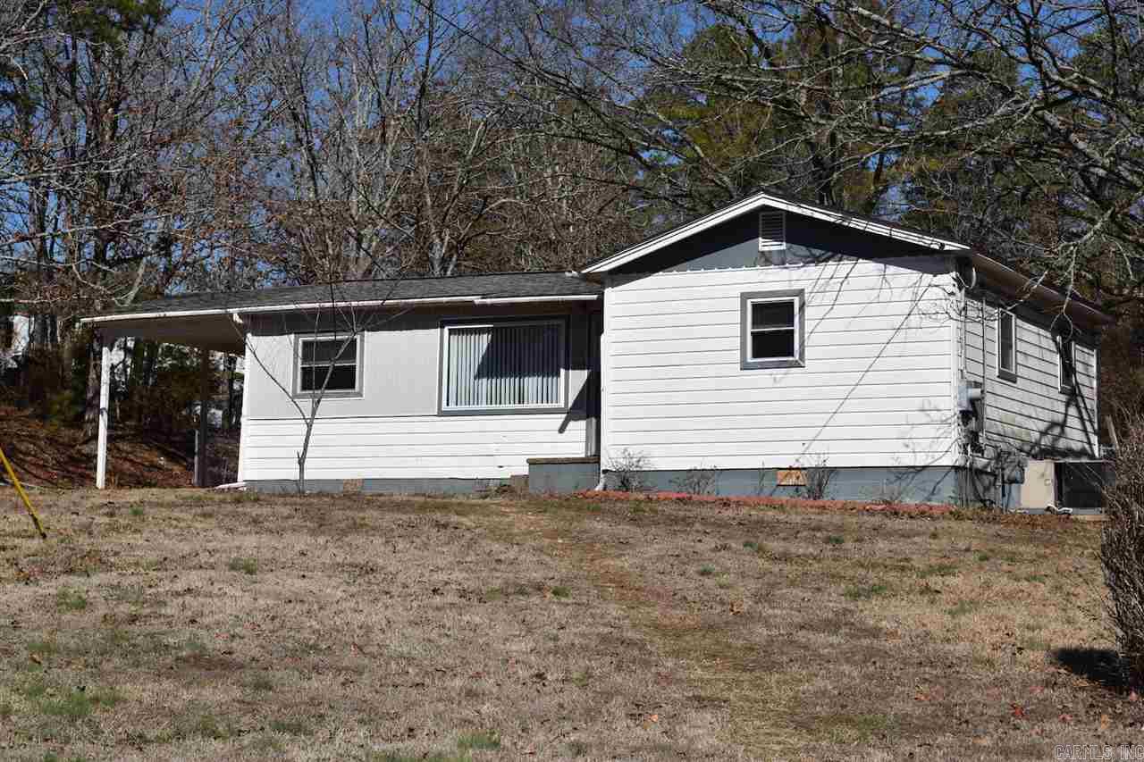 Darling 2 bed / 1 bath home in Lake Hamilton School District (LHSD). Move in ready! Beautiful hardwood floors (original), large kitchen with lots of storage, recently remodeled bathroom, and separate laundry room. CH&A, double hung windows, 1 year Home Warranty! Gas stove & refrigerator convey (house not plumbed for ice maker). Quiet neighborhood at end of cul de sac. Great price point - won't last long! Perfect starter home or investment. Lots of potential here! Lot and room sizes are approximate.
