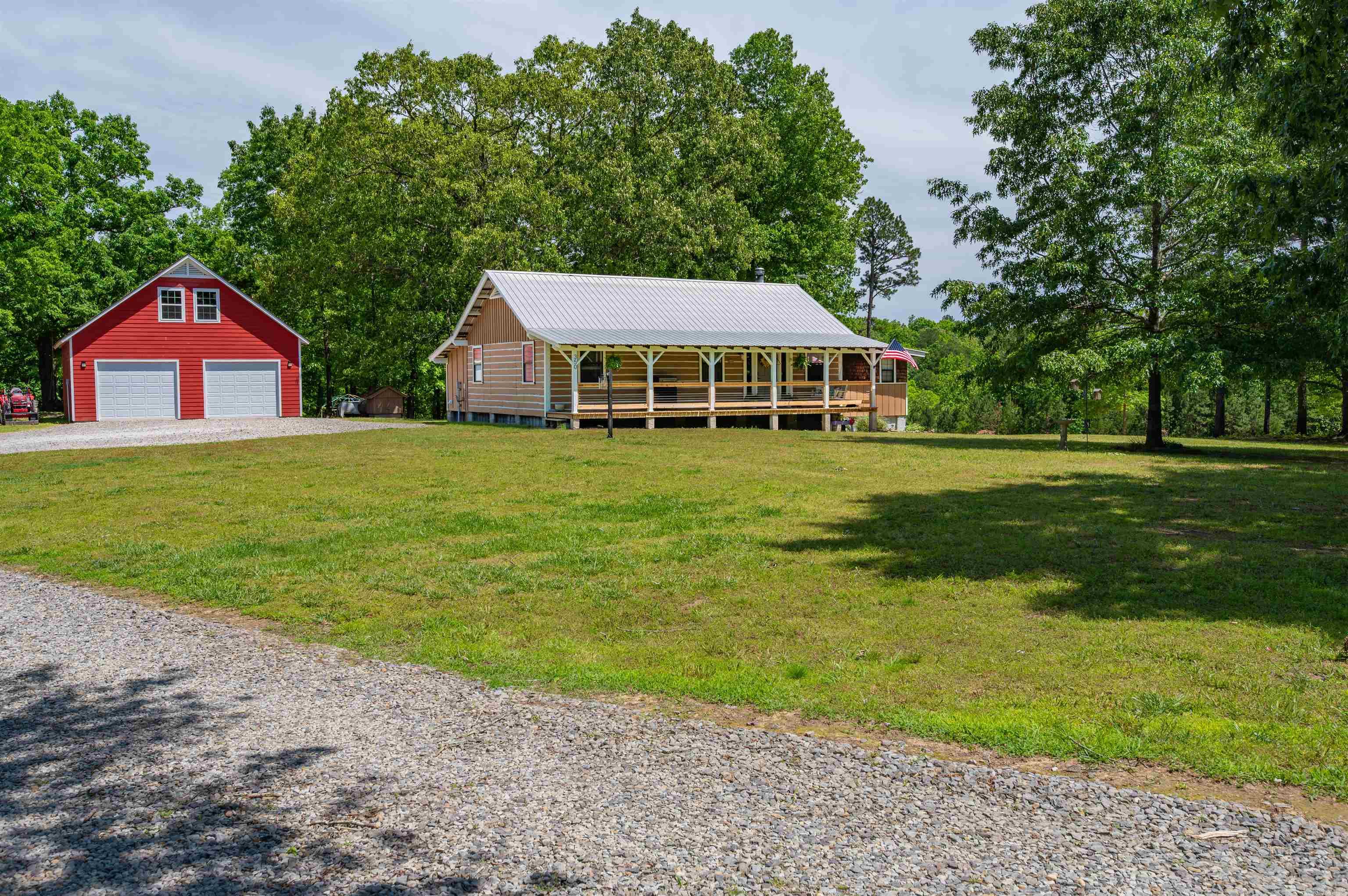 What if your dreams had an address? This authentic 3-bedroom, 1.5-bath log cabin sits on 10.14 private acres just 20 minutes from the Little Red River. With 1,608 square feet of warm, inviting living space, it's the kind of place that feels like home before you even step inside. But the real story is outside. A massive shop offers room for projects, equipment, hobbies, or business use, with generous storage space above. The acreage is heavily wooded for privacy and seclusion, yet still offers plenty of flat, usable ground ready for a garden, animals, trails, recreation, or whatever you've always wanted to create. No HOA. No restrictions. No one telling you what you can and can't do. Whether you're looking for a homestead, weekend retreat, hunting property, or simply a place to breathe, this one delivers something that's getting harder and harder to find.
