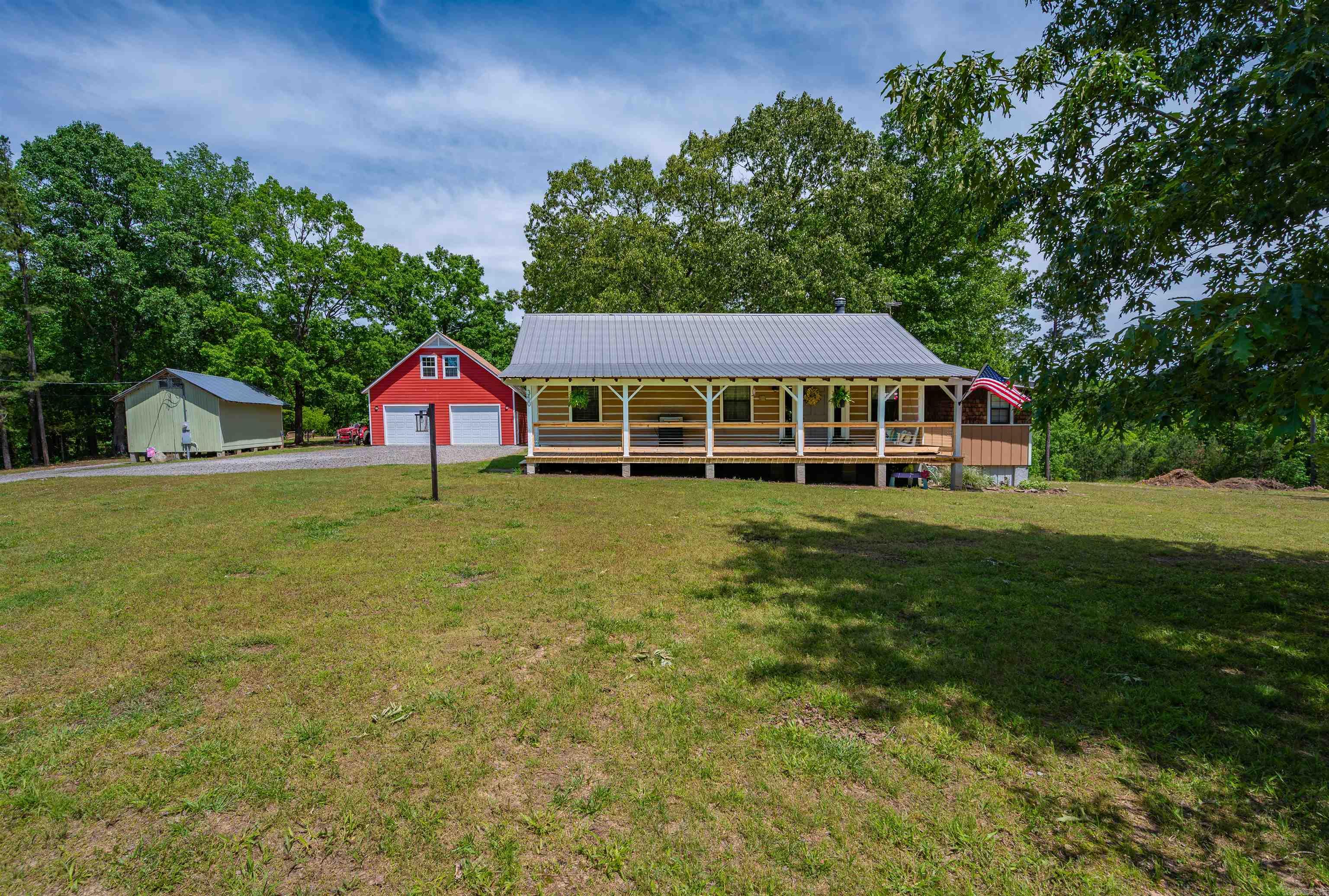 Ready to trade the city for something real? This charming 3-bedroom, 1.5-bath log cabin is tucked on 9.5 unrestricted acres 20 minutes from the Little Red River. At 1,608 square feet, it's cozy and welcoming, laid out well for a family, and the charm hits you the moment you pull up the drive. And yes, it's a real log cabin — not "cabin-style" — which makes all the difference. The land and the extras are what truly set this one apart. The shop is massive and seriously impressive, with great storage space above. A sweet little outbuilding on the property is already being converted into a mother-in-law suite — a few finishing touches and it could be an incredible private space for family or guests. The acreage is heavily wooded and wonderfully private, but don't let that fool you. There's plenty of flat, open ground that's clean and ready for whatever you're dreaming up. 9.5 unrestricted acres — and not a soul to tell you what to do with them.