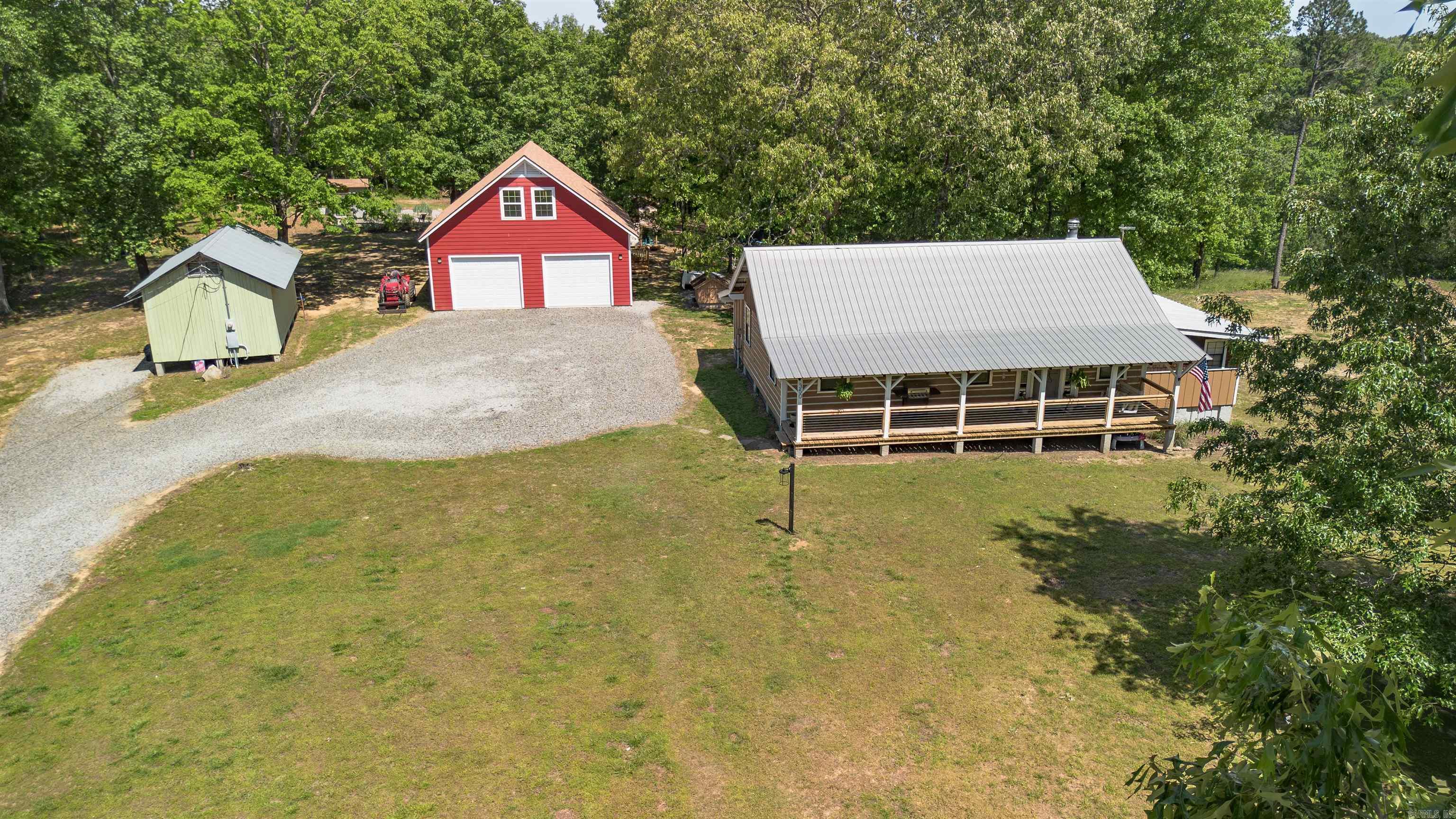 What if your dreams had an address? Trade traffic, noise, and neighbors for 9.5 unrestricted acres of Arkansas woods, fresh air, and complete freedom! This authentic 3-bedroom, 1.5-bath log cabin sits on 9.5 private acres just 20 minutes from the Little Red River. With 1,608 square feet of warm, inviting living space, it's the kind of place that feels like home before you even step inside. But the real story is outside.. A massive shop offers room for projects, equipment, hobbies, or business use, with generous storage space above. There's also a separate outbuilding already being transformed into a mother-in-law suite. Finish it out and you'll have a fantastic private space for guests, extended family, or even potential rental opportunities. The acreage is heavily wooded for privacy and seclusion, yet still offers plenty of flat, usable ground ready for a garden, animals, trails, recreation, or whatever you've always wanted to create. No HOA. No restrictions. No one telling you what you can and can't do. Whether you're looking for a homestead, weekend retreat, hunting property, or simply a place to breathe, this one delivers something that's getting harder and harder to find