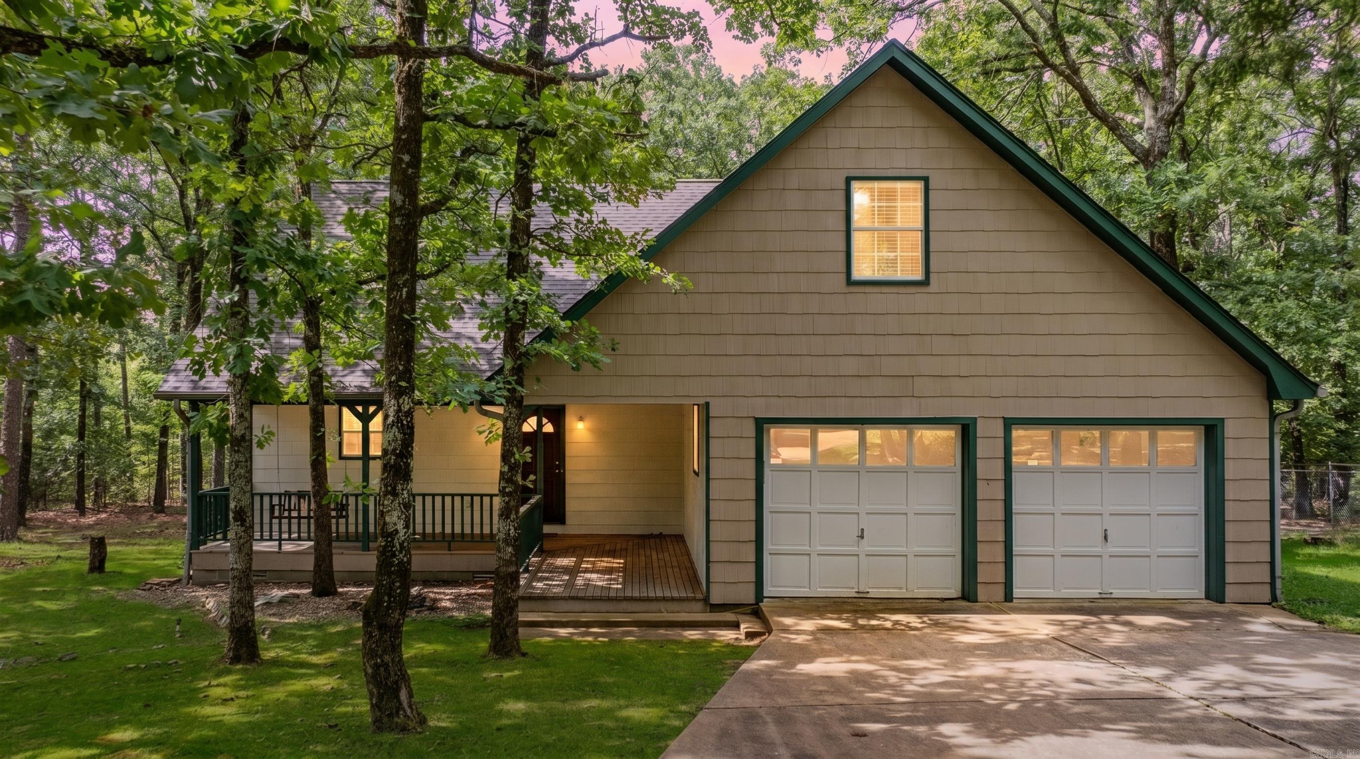 Just Appraised May-2026 at $345,000! Tucked away among the trees in an exclusive gated cul-de-sac with only 3 homes, this move-in ready retreat offers the privacy you've been searching for without sacrificing modern conveniences, including fiber internet. Step inside to a stunning great room with soaring 20-foot ceilings that create an open, airy feel and flow seamlessly into the kitchen and dining area. The beautifully updated kitchen features quartz countertops, subway tile backsplash, stainless steel appliances, and plenty of workspace. Durable LVP flooring adds style and functionality throughout. Enjoy peaceful wooded views from the overlooking balcony, perfect for morning coffee or unwinding after a long day. The spacious layout includes massive closets and two bonus storage/craft rooms, offering endless possibilities for hobbies, a home office, workout space, or additional storage. If you've been looking for a private, wooded home with modern updates, abundant storage, and a unique setting, this one is a must-see!
