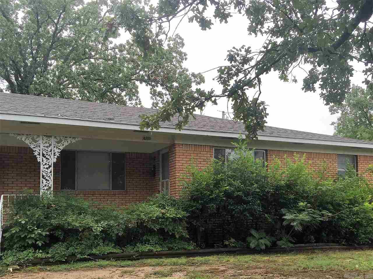 Spacious 3BR, 2BA one-level !Hardwood Floors !!! 1-car Carport !   Fireplace w/gas starter !Common fenced area!  Cats or small dog under 10 lbs with Owner Approval Pet Fee based on type & size.