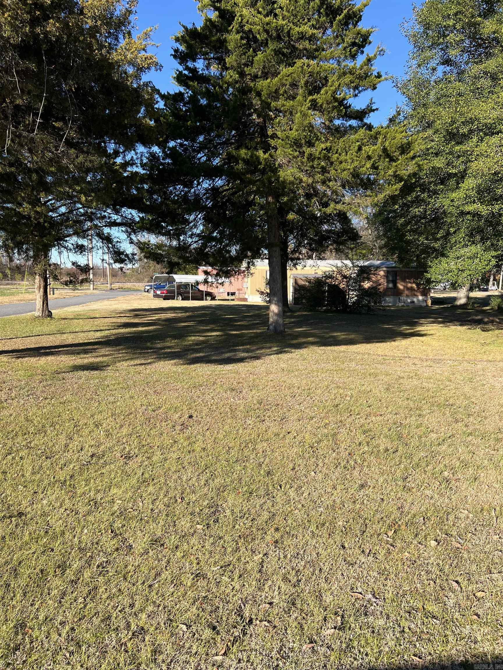 Mobile home park-4 trailers (3 have tenants currently) Owner pays water(septic), trash, taxes, sewer and mowing common areas.  Tenant pays Elec and Monthly trailer fee in rent.  Single wide trailers.  Property has been grandfathered in so if you take out a trailer you can't put a new on in its place.  Buyer/Agent is responsible to double check zoning with City of NLR.  Zoned C4 (heavy commercial).   AGENTS SEE REMARKS.