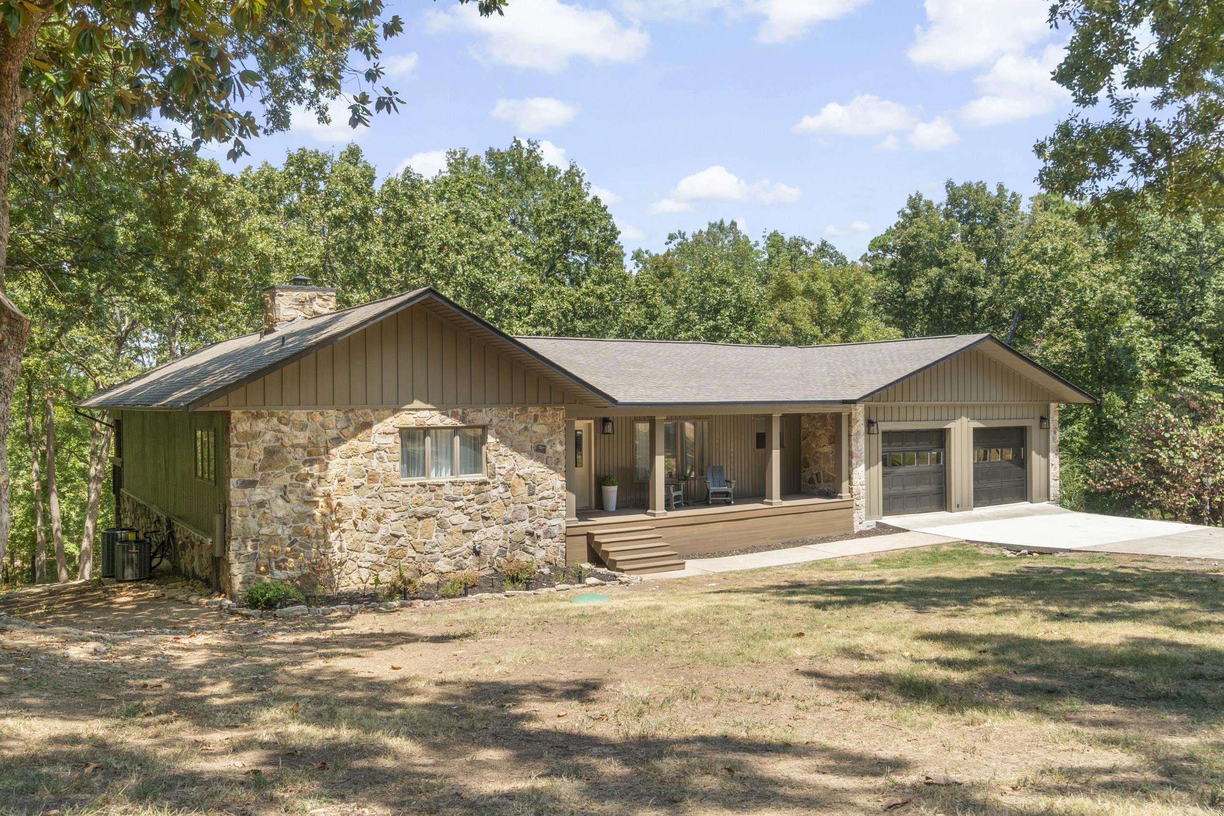 The Perfect Greers Ferry Lake Family Home. Easy walk to Beloit Bay Cove & Heber Springs Marina just down the street. Totally remodeled with attention to detail that speaks to the quality of workmanship & thought that meets the needs of 2026 Buyers. Open concept living space on the main level for easy entertaining. Native stone fireplace, vaulted ceiling, wall of glass leading to a large covered deck overlooking the lake & backyard firepit. All new kitchen, laundry room & 1/2 bath. Walkout basement level boasting a family room, game room, 3 Bedrooms & full bath. The Master Bedroom suite is located on the main level. Plenty of room to spread out! All appliances are included in the listing price. Huge 31 x 36.9 dream garage to fit all your lake toys. SEE ASSOCIATED DOCUMENTS for larger floor plan and detailed information.