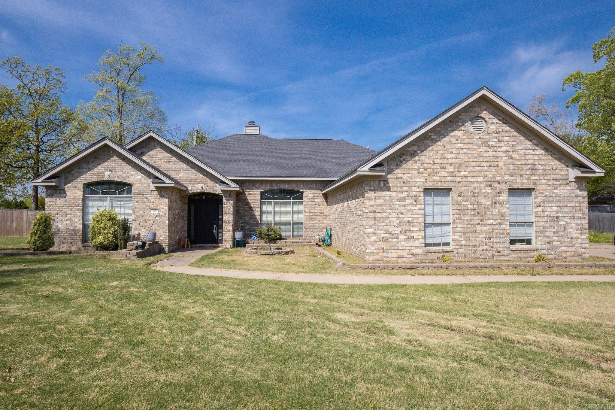 Spacious 4 bedroom 2 bath home tucked in the woodlands subdivision on a quiet culde sac lot.  Built in 2001, this property offers over 2500 sq ft of comfortable living space with high ceilings and one level layout. There is a large living room, separate dining room, and an inviting kitchen with breakfast bar and updated tile flooring, ample cabinetry, and a great workspace for cooking and gathering.  Major updates include new hvac 2025 & new water heater 2025, & fence was added a few years ago. 2 car garage and back patio area.