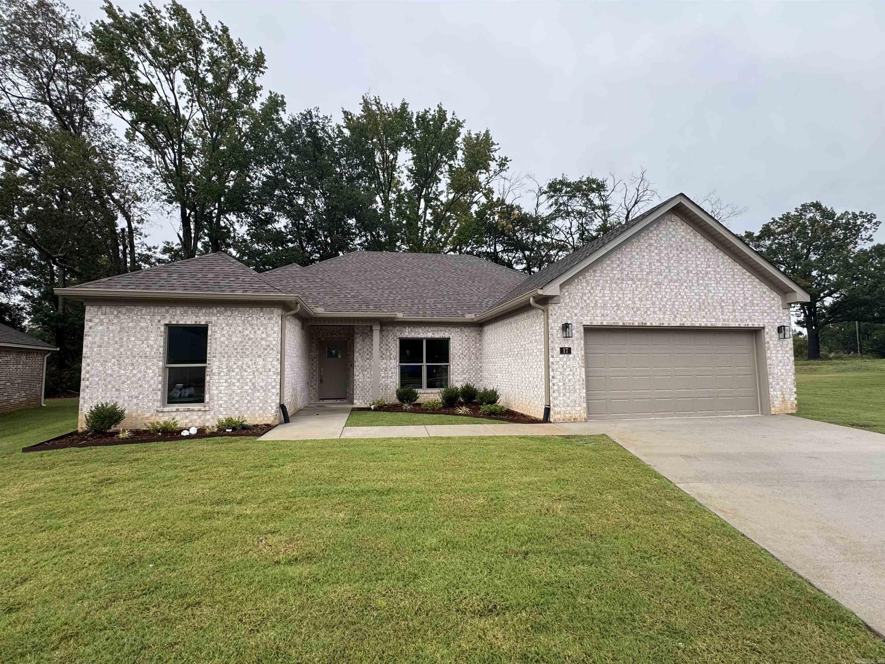 Welcome to Carmel Oaks, one of Cabot's newest communities, only 12 miles from the Little Rock Air Force Base.  This NEW construction floor plan offers 4-bedrooms and 2-bathrooms. As you enter, you’re greeted by tall ceilings, a cozy fireplace, crown molding, and an open floor plan that seamlessly connects the living, dining, and kitchen areas. The MASSIVE living area features natural light and a seamless flow into the designated dining area with a great view of the covered back patio! This home utilizes SOLAR board roof decking for energy efficiency. Other features include: floored attic space for ample storage, 42" custom kitchen cabinet upgrades, granite countertops, custom kitchen pantry with a receptacle for your coffee station, LVP flooring, tiled shower in the master bathroom, comfort height toilets, large custom walk-in master closet, 50 gallon water heater, recessed lighting AND ceiling fans, elegant finishes and neutral tones to enhance versatility. This property is also equipped with an irrigation system. Located in highly sought after Cabot School District. Several new-homes and floor plans to choose from! (Photos may not show exact finishes of this address.)