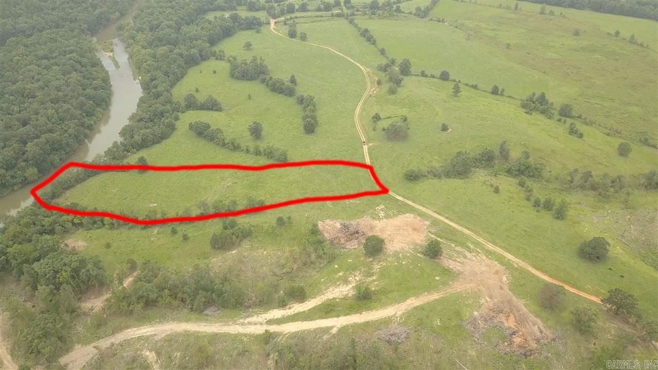 LOT #4.  This parcel is approx. 5.15 acres on the Ouachita River with a nice Building site.  Some restrictions apply.  This property to be Surveyed prior to closing to determine exact acreage and then that acreage at $10,600.00 per acre is the selling price.  All Lots subject to road easement and will share easement road to river access.  Polk Road 684 is the west line and the river is the east line.  The Polk / Montgomery county line goes through these Lots.
