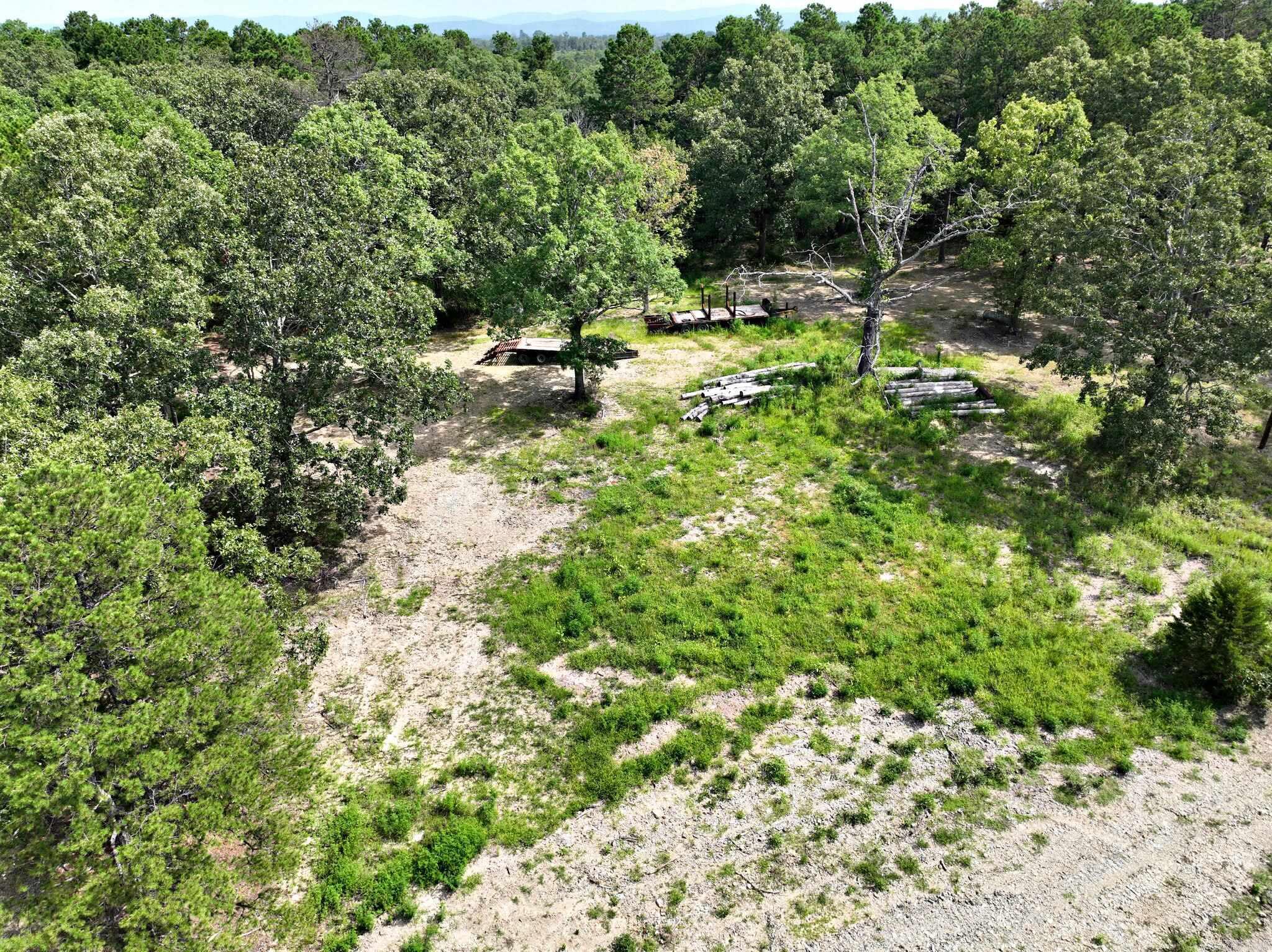 3.04-acre tract with an identified potential building area, with rural water and power available and septic to be installed by the seller with an acceptable offer. The property has reportedly passed a percolation test and offers scenic views in a generally peaceful, rural setting, located just minutes from area ATV trails and other local recreation. Recorded restrictions do not allow mobile homes. County taxes will be assessed once the subdivision process is complete. This acreage may be suitable for a primary residence or periodic use as a second-home site, subject to buyer verification of utilities, restrictions, and intended use.
