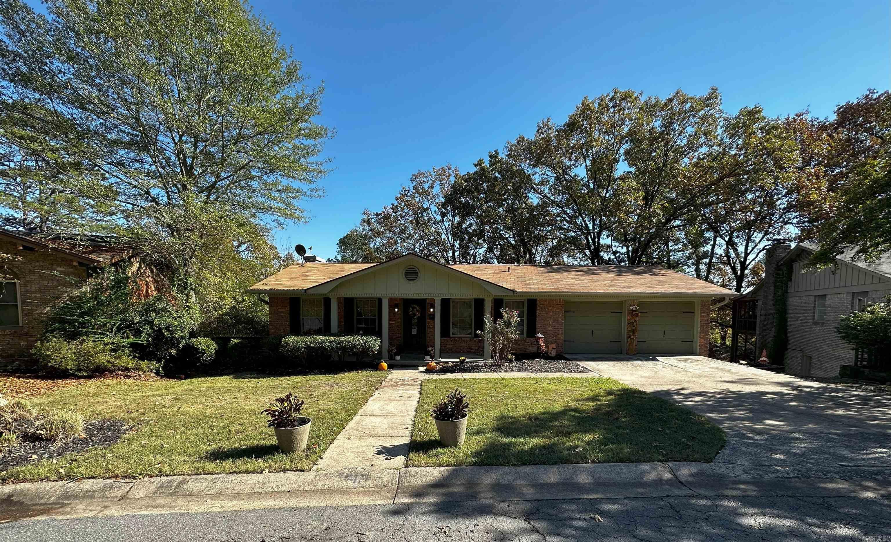 This 1969-built gem seamlessly blends classic charm with contemporary conveniences. With a new roof and all new fencing installed in 2022, this well-maintained property offers the perfect balance of vintage character & modern reliability. You'll be immediately greeted by the warmth of the original hardwood floors in the formal dining room & living space. Their patina exudes character & creates an inviting ambiance. The formal dining room is ideal for hosting gatherings & special occasions, with plenty of space for everyone. The oversized living room window is a true focal point, showcasing natural light & offering captivating views of the extensive backyard, stretching all the way to the next street.  Imagine creating your own private oasis, a lush garden, a play area, or even an outdoor entertainment space. The possibilities are limited only by your imagination, & this generous backyard offers a blank canvas for your dream outdoor space. Located in Leawood, this home is conveniently situated near schools, parks, shopping, and more. Easy access to the interstate while still being secluded. Please Note the oversized back deck has been professionally anchored to the house.