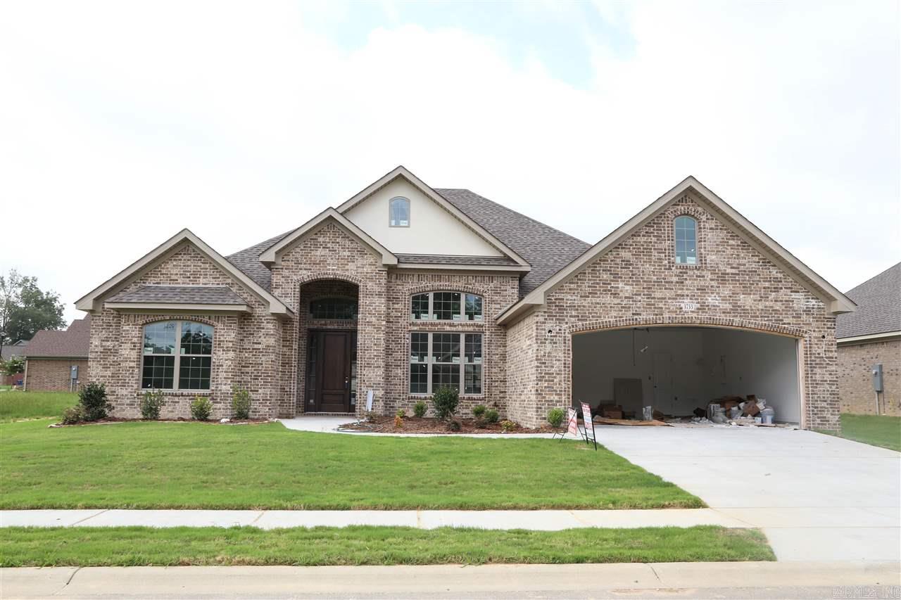 Beautiful new all brick home in great location and still time to pick your interior colors! Grand entry with 14ft ceilings into this lovely home with wood flooring in foyer, dining room, living room, and tile floor in all wet areas. Large living room that is partially open to kitchen with breakfast bar, custom built cabinets, granite countertops, lots of trim and crown molding throughout the home. Master bath has whirlpool tub and separate large custom tile shower. Completion date to be June.