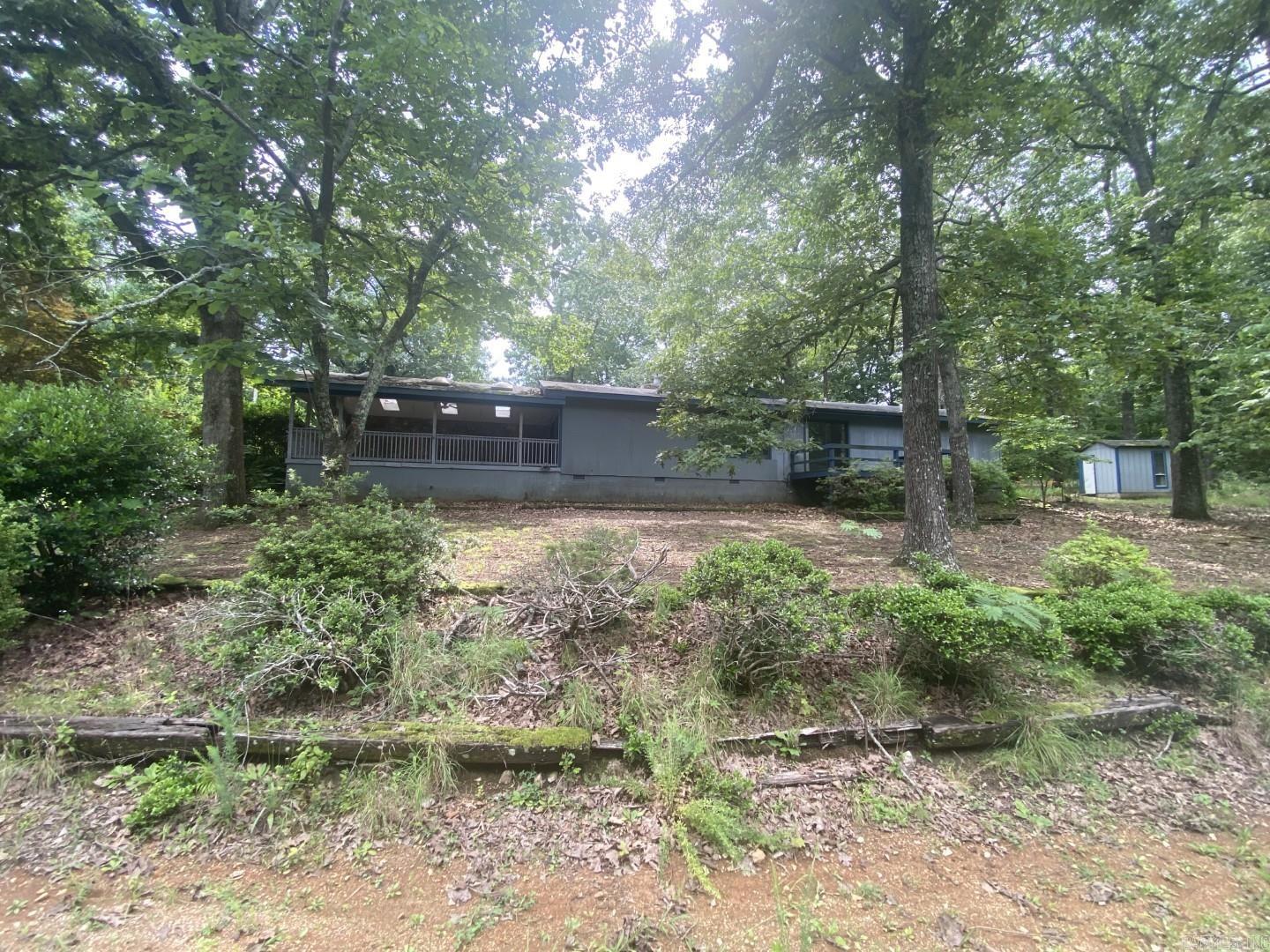 Timeless architectural details in this 3 bedroom, 3 bath, one level home located in Cherokee Village! Yes it needs TLC but has so much character in the living room with exposed beam ceilings, hardwood floors, and a massive stone see-through fireplace shared with the kitchen. HUD Case #031-353249. Agents /purchasers refer to HUDHomestore.gov for info on buying and bidding on HUD-owned homes. Sold AS-IS. Managed by www.olympusams-at.com. Agents see additional remarks.