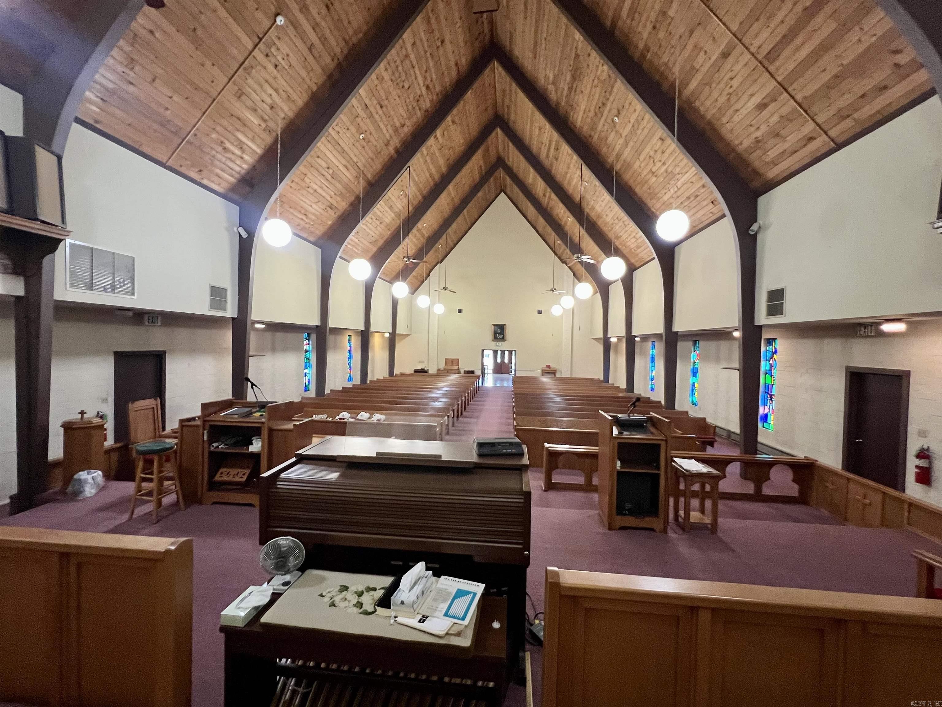 Previous church facility. Any use allowed by seller, check with city planning commission. Almost 12k square ft facility on 2 acres. Approximate 4500 SF sanctuary with lights, fans, pews, organ and sound system.  Approximate 715 SF full kitchen with sinks, ventahood, stove, appliances.  Appointed offices, classrooms, storage closets, and fellowship hall.  4 restrooms. Asphalt parking. Property being sold as-is present condition. All showings must be accompanied by a Realtor. NO Disclosures provided by seller. Existing personal property will remain but will not be considered part of the sale.  Any items left in the building will be considered as-is and abandoned and will have zero value.  Seller makes no guarantees, warranties, or representations of any kind regarding the existence, condition, or usability of said personal property which will remain in building at closing. Title transferred by Special Warranty Deed/Trustee Deed.