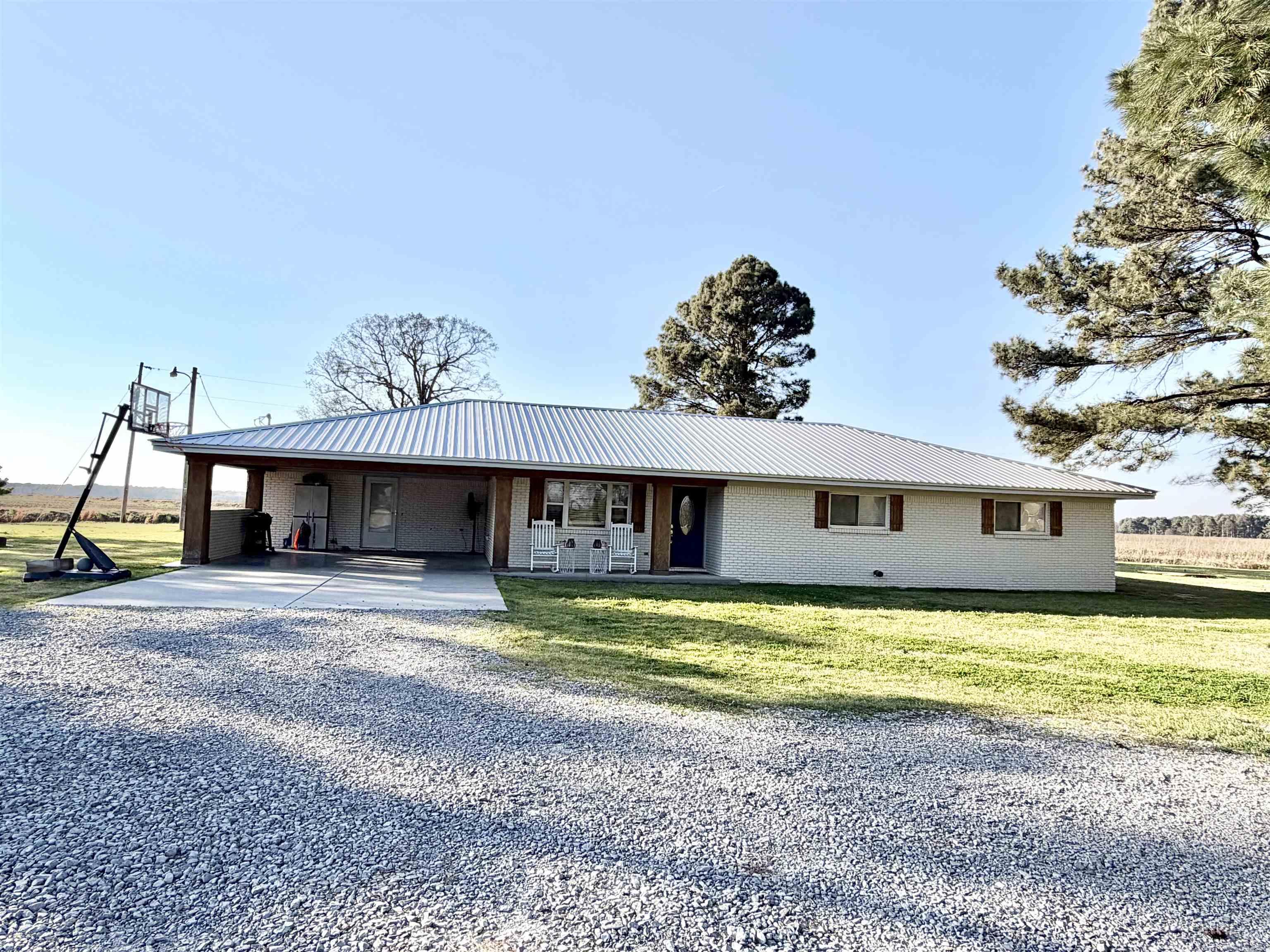 Recently remodeled home situated on 2 acres of peaceful, private surroundings. Updates include new LVP flooring throughout, fresh sheetrock, and all-new interior and exterior paint. The kitchen features beautiful butcher block countertops, while the bathrooms are finished with elegant Calcutta quartz countertops. While thoughtfully updated, the home retains its original charm with cedar walls and ceilings showcased in the bathroom and 4th bedroom or additional living space. Additional improvements include new metal roofs on both the home and shops, as well as a recently serviced septic system. With numerous upgrades throughout, this property is truly move-in ready and offers the perfect blend of modern updates and serene country living.