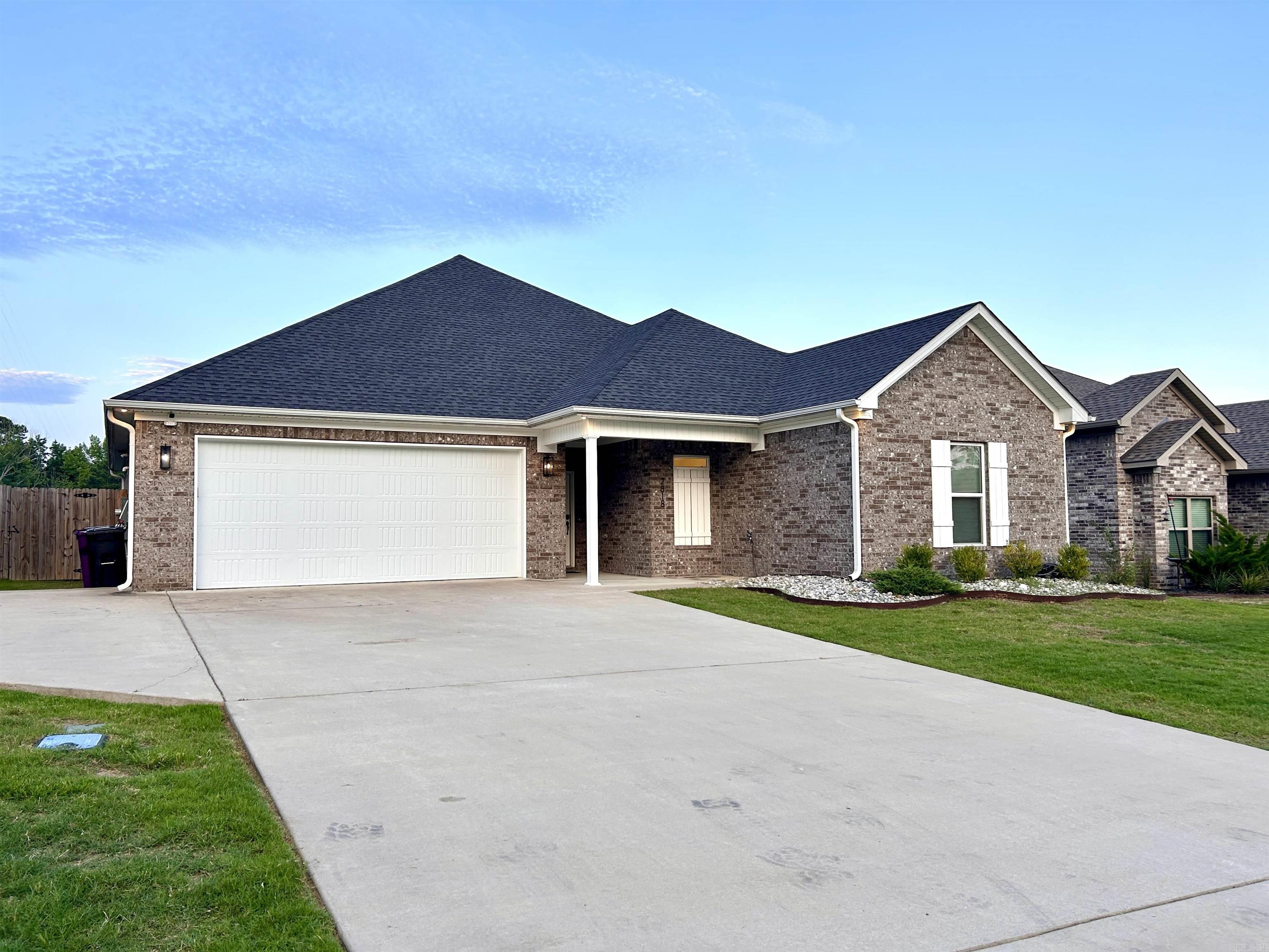 OH MY!  Here's what you've been looking for!   Immaculate, well maintained, affordable 4 bedroom home in Bryant Schools with easy access to I-30, Bryant or Benton!   This all brick home is less than five years old and still looks as good a new. It features an open floor plan with spacious kitchen!  Beautiful cabinets, plenty of counter space, pantry and large island breakfast bar.   The focal point of the living area is a beautiful shiplap floor to ceiling fireplace.   Natural light shines thru the large windows overlooking the covered patio.   This split floor plans offers a large primary bedroom.  The primary bath boasts a walk-in shower, soaking tub, double sink vanity and large walk-in closet.  A mudroom is just inside the house from the two-car garage, while the large laundry room is located near the back door.   Easy to clean floors - there's no carpet.  The backyard is level and fully fenced - a perfect place to play, garden or entertain.   Make your appointment today!