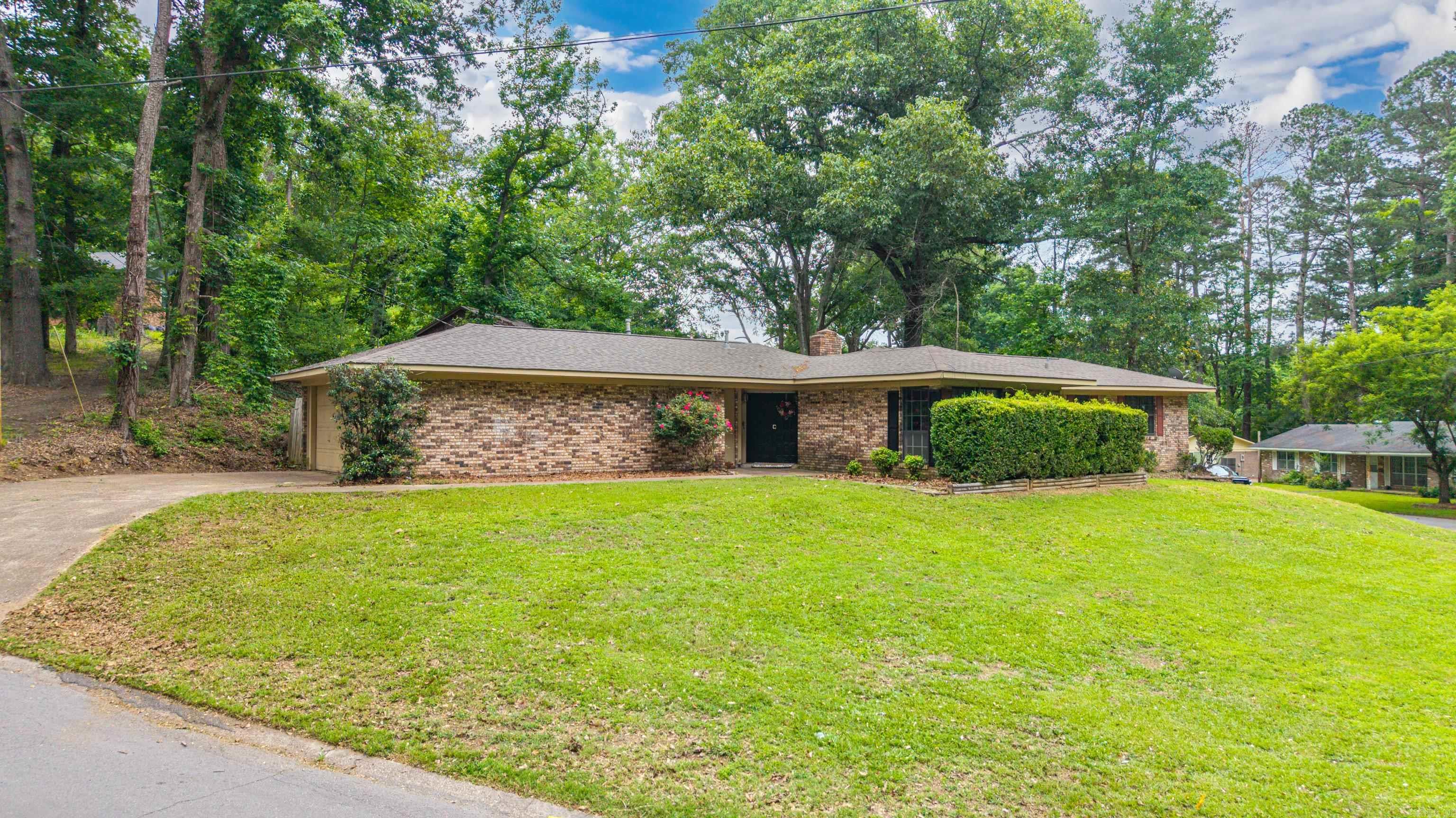 Charming Brick Home with a Mid Century Vibe in a Wonderful Established Neighborhood! This cozy 3bedroom, 2bath home is full of character, featuring built-in shelving, a warm wood-burning fireplace, and charming details throughout. The spacious floor plan offers plenty of room to relax or entertain. Situated on a large lot, the property also includes an in-ground pool—perfect for summer fun and backyard gatherings. With just a splash of your own TLC, this home has the potential to truly shine. A fantastic opportunity nestled in a great little neighborhood. Perfect home to make your own.