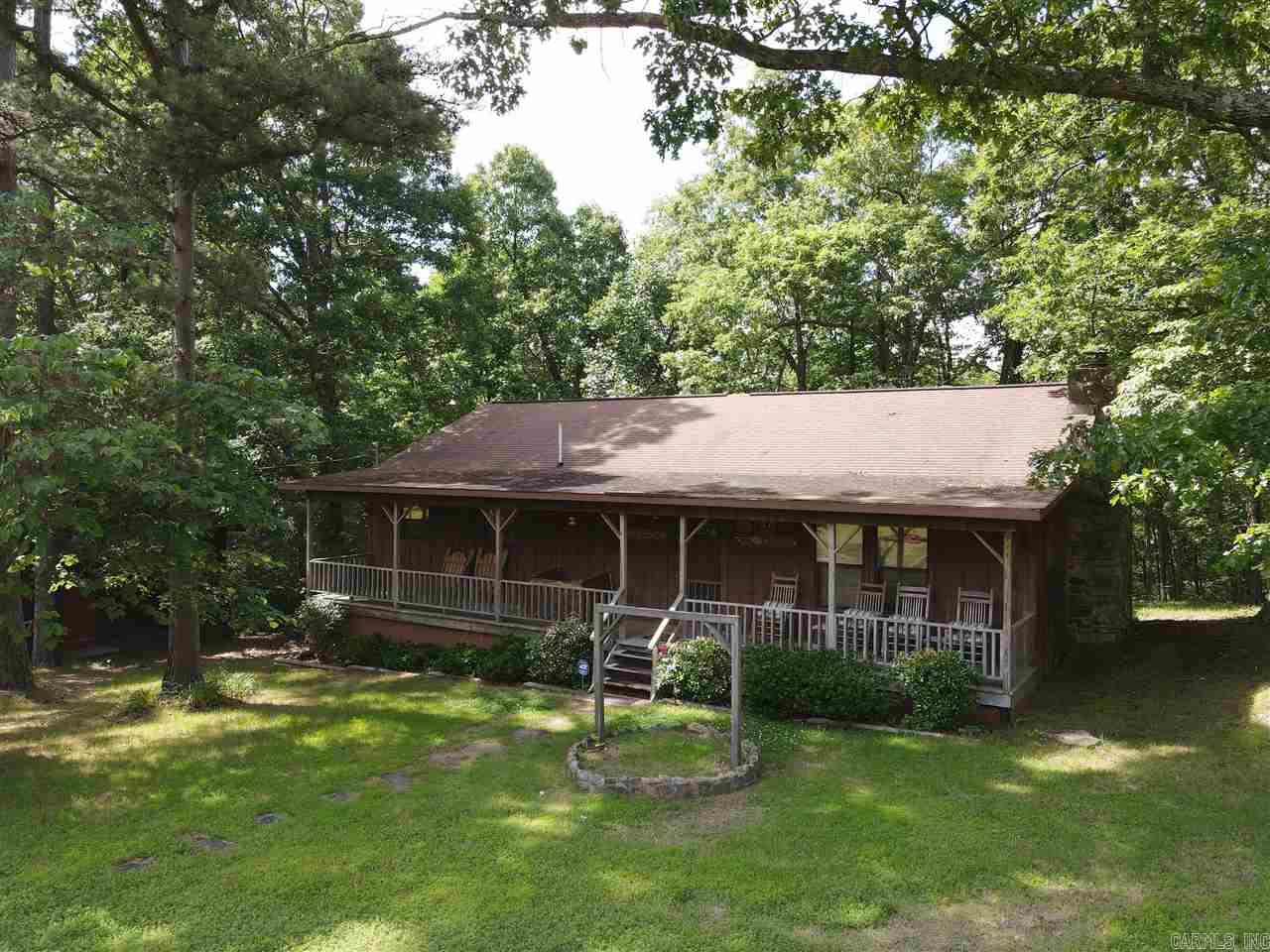 What more could you be looking for in a hunting property? This tract really does check all the boxes. As you pull into the private drive, an automatic gate welcomes you as you meander up through the incredible stand of hardwood timber. The canopy blankets the drive as if you are driving through a tunnel of nature. Strategically placed at the top of the road is the spacious, cozy and fully furnished hunting lodge.