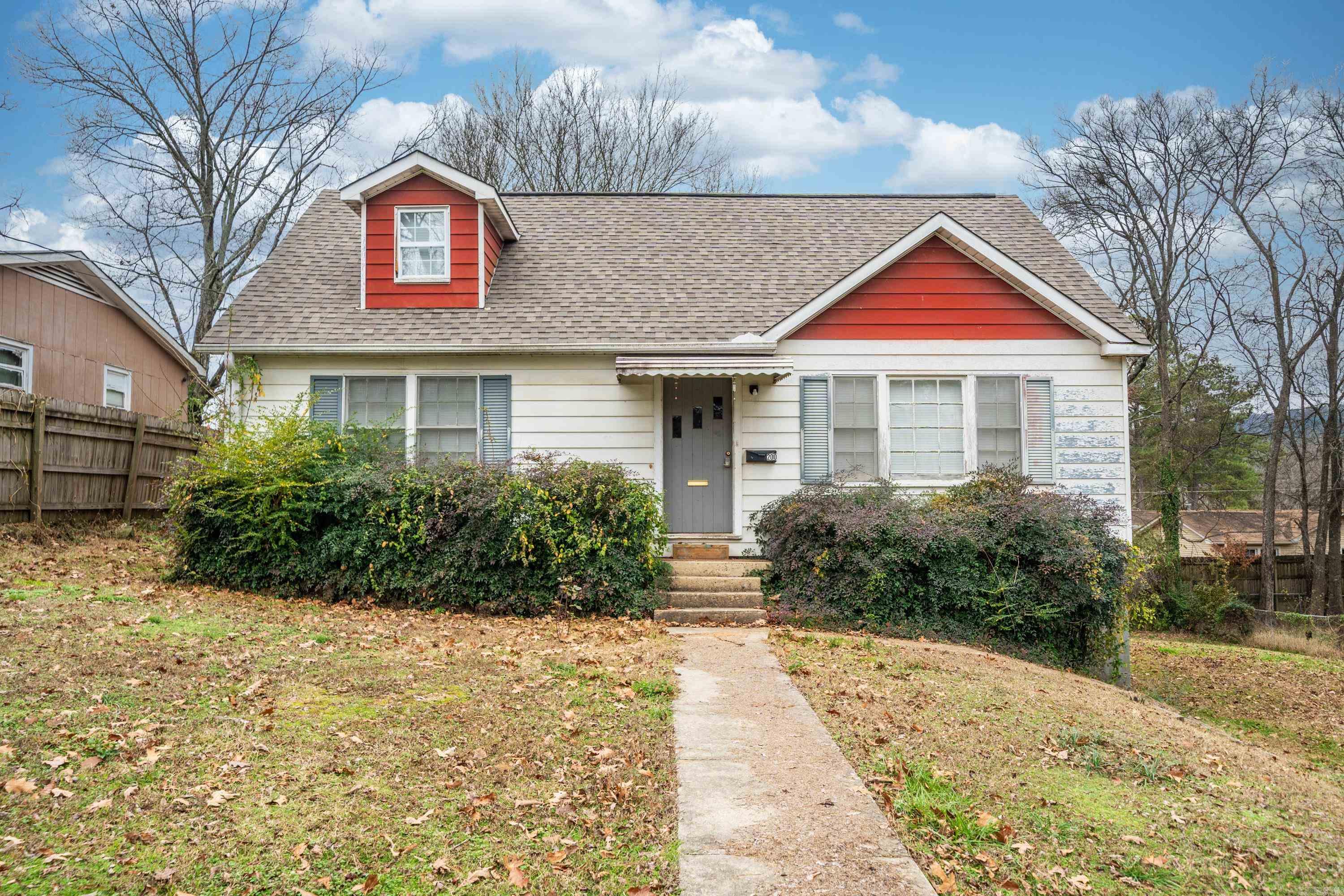 Charming Bungalow in the Heart of Hot Springs! Original hardwood floors, new heat/air and stove 2022, and large basement/workshop. Main level includes living, dining, kitchen, 2 bedrooms and one bath, upper level includes two bedrooms.