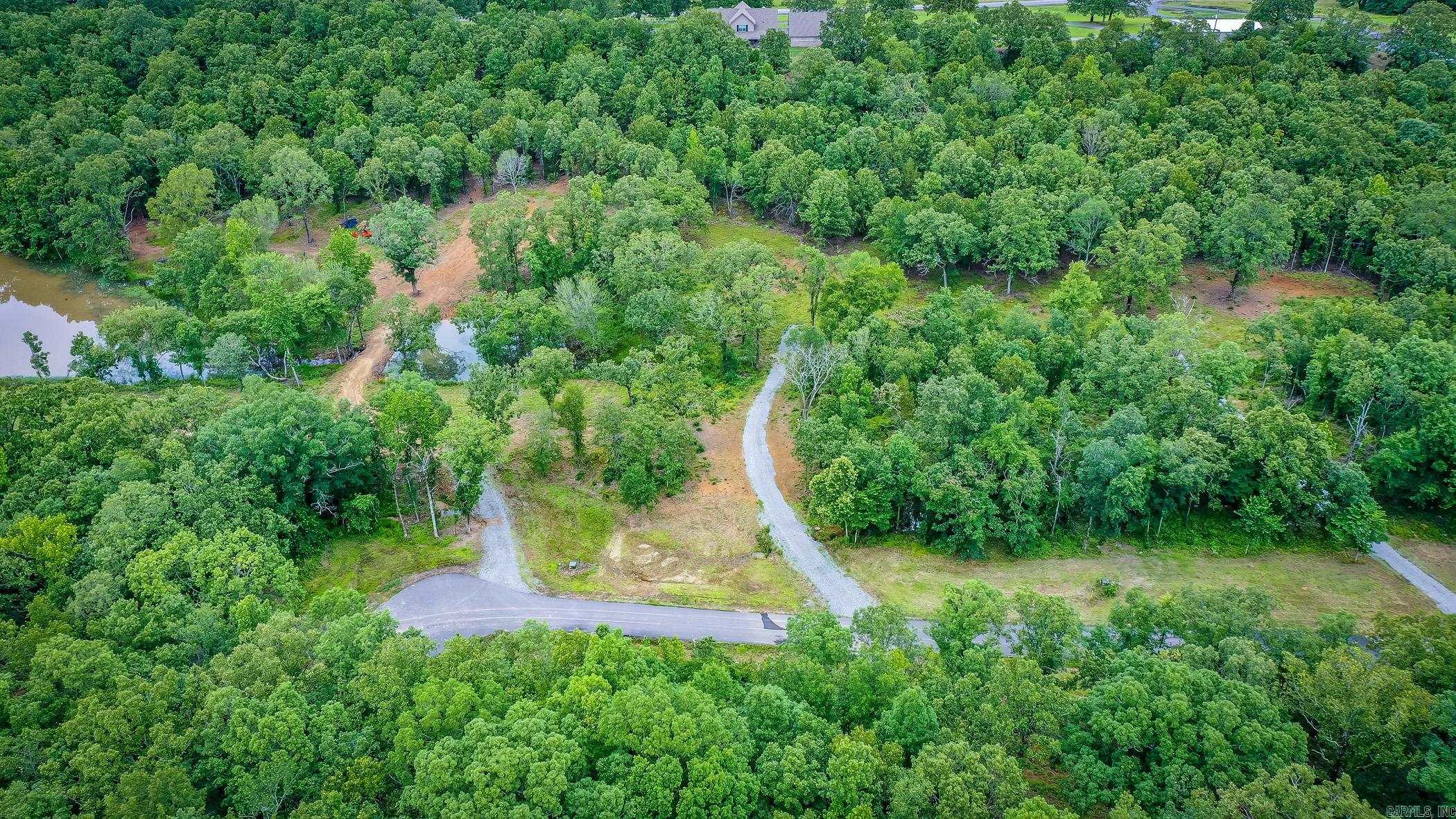 One of the last flat lots left in Mountain Ranch Estates. This one has utilities at road and driveways already in! Ready to build your dream home in this gated subdivision just minutes from town. Over two acres to enjoy. Can be purchased with lot 103 for over 4.5 acres!
