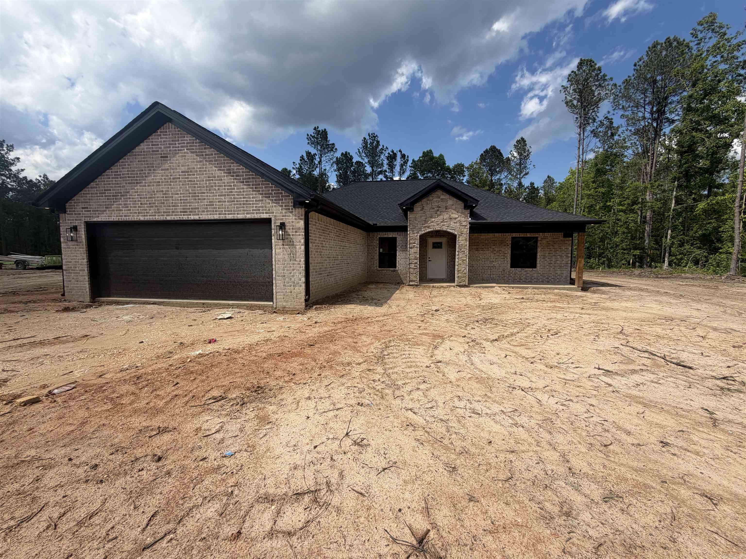 Welcome to this beautiful all brick home offering 3 bedrooms, 2 bathrooms, plus a small dedicated office, perfectly designed with comfort and functionality in mind. Situated on 2.18 acres, this property provides the ideal blend of space, privacy, and modern living. When you step inside you'll find an inviting open concept layout featuring a cozy gas fireplace and the spacious kitchen includes a large pantry with plenty of storage, making organization effortless. Just off the garage entry, you'll love the convenient mud room complete with built-ins for everyday storage needs. The private primary suite is a true retreat with a spa-like bathroom featuring a beautiful walk-in shower, soaking tub, double vanities, and an oversized walk-in closet. With thoughtful details throughout and plenty of outdoor space to enjoy, this home offers everything you've been looking for! Schedule your showing today!!