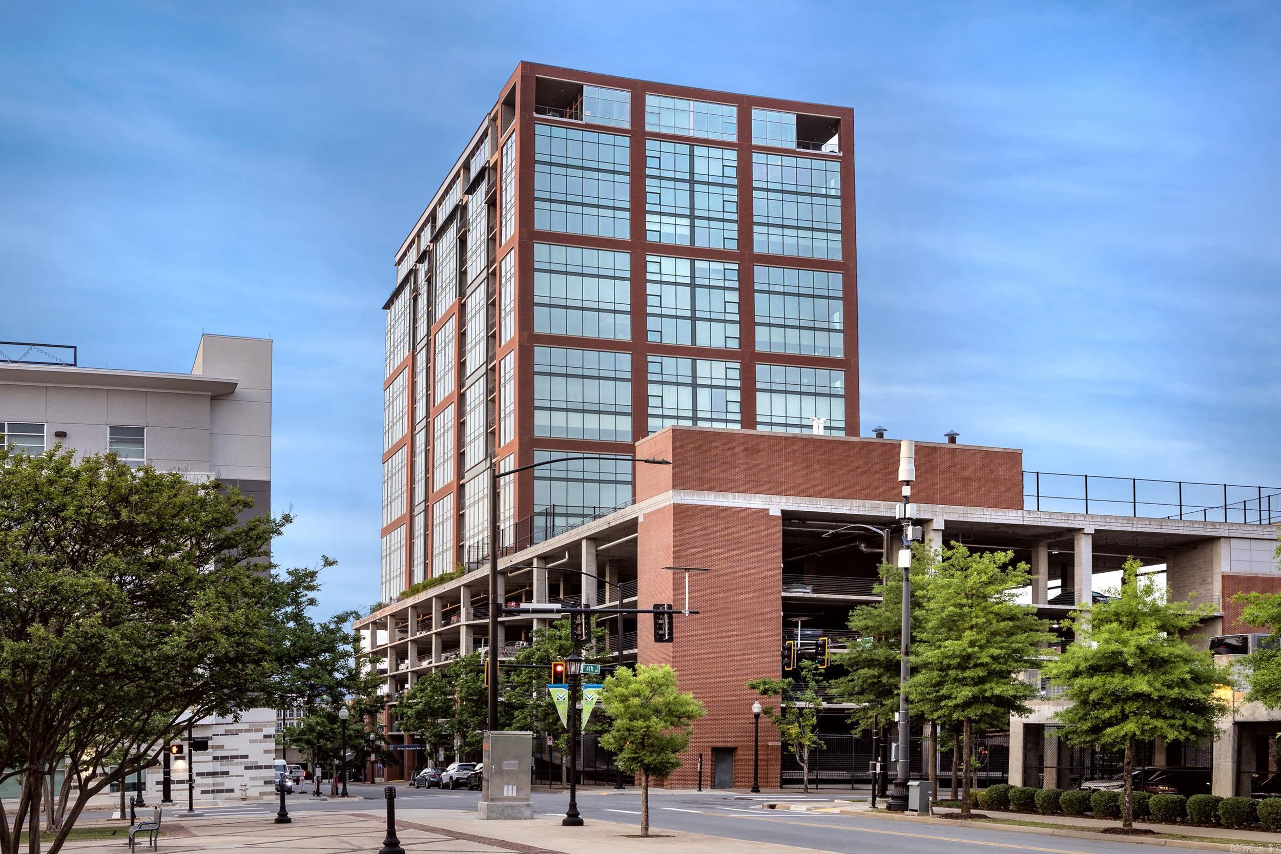 Condo living at its finest in the River Market Towerjust got better!  Come see the newly remodeled lobby and fitness facility.  Enjoy sweeping views of the city and Arkansas River when living in this incredible condo.  This 2 BR/2BA condo offers new hardwood floors throughout, premium appliance package, located in the heart of the River Market District within walking distance to area restaurants, bars, galleries and shopping.  Building amenities include swimming pool, fitness center, tennis and basketball courts, rooftop deck and party room and concierge services are included.  This unit comes with two reserved parking spaces in the secure garage and one storage unit (not climate controlled). NEW HVAC JUNE 2025!! This is a MUST SEE!