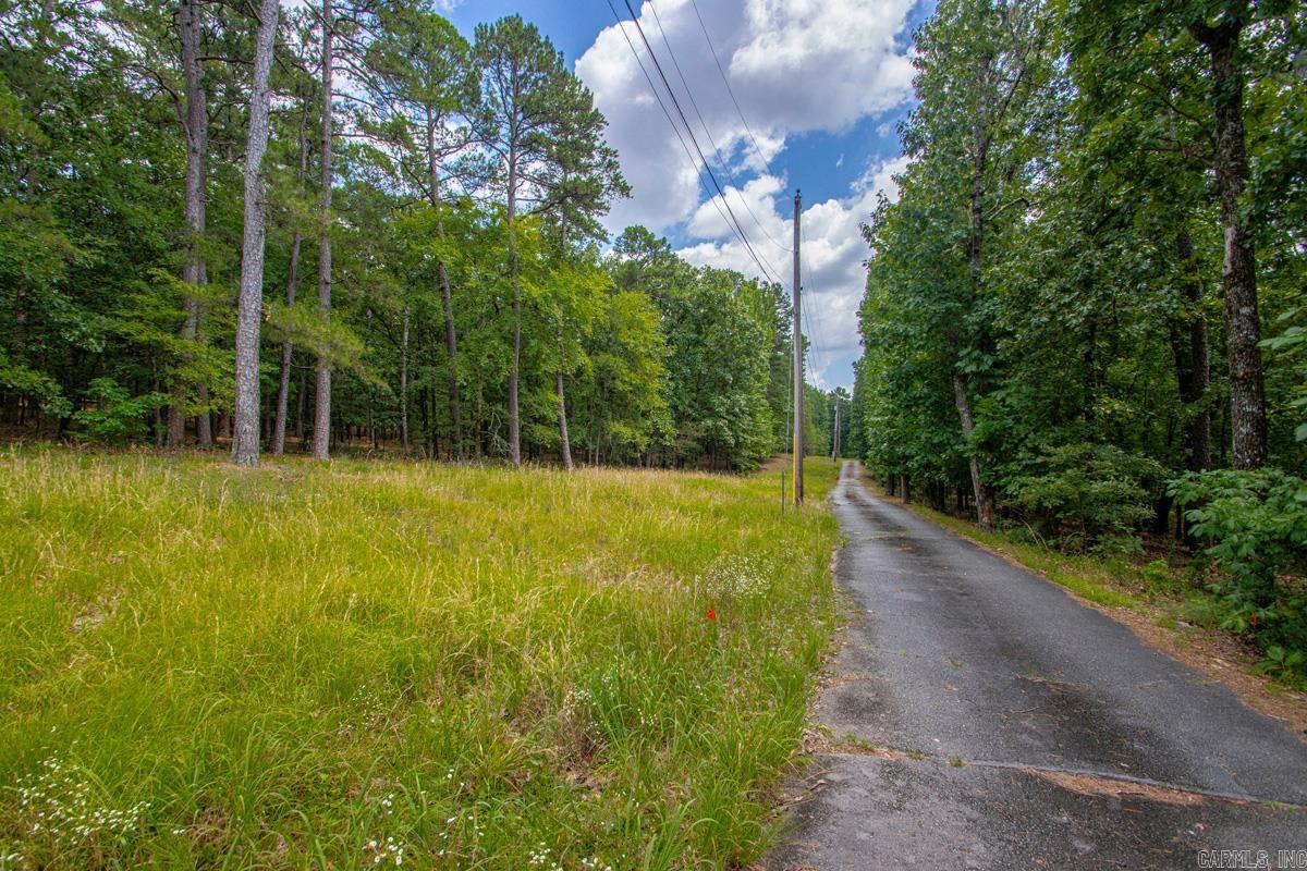 Rare opportunity to own approximately 5 acres in one of West Little Rock's most desirable locations. The property features a private, wooded setting with endless possibilities for a custom estate. Existing home conveys at no value and is being sold as-is. Large acreage tracts of this size are increasingly hard to find in the heart of Little Rock while still offering convenient access to shopping, dining, healthcare, and major roadways. Bring your vision and explore the potential this exceptional property has to offer.  See agent remarks