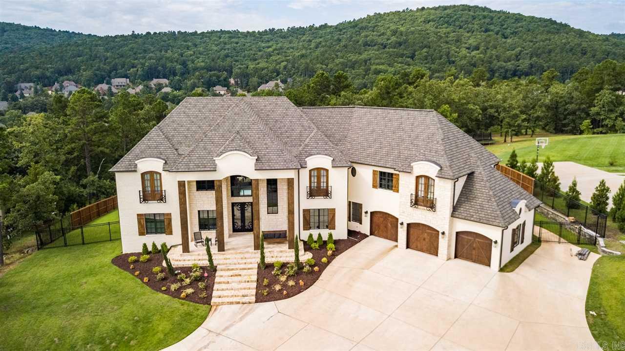 Gorgeous custom estate! Heavy wrought iron & glass front entry opens to soaring great room w/wood beams & lrg informal dining area. Beautiful quartz island, professional appliances & tall cabinets in the spacious kitchen. Master ste w/FP & remote blinds, heated bath floors, soaking tub & custom closet. Office, laundry, full bath & gym also on main. 4 generous sized guest BDRM suites, Bonus/Game Rm, 2nd Lndry w/frig & floored attic access up. UV heated pool & outdoor living w/WBFP & kitchen. Come See!