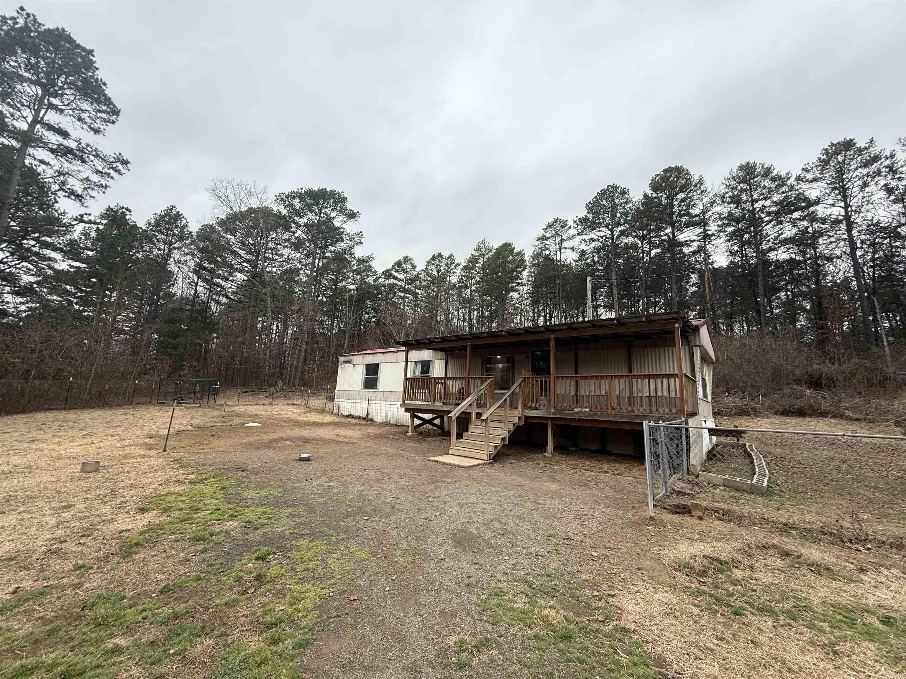 Affordable country living on 3 acres! This 2-bedroom 1-bath mobile home offers a great opportunity for investors, first-time buyers, or anyone looking to add their personal touch. Nestled in a peaceful setting with plenty of privacy, the property features a fenced-in yard--perfect for pets, gardening, or outdoor enjoyment. Two storage sheds convey, providing extra space for storage. With room to expand, update. Enjoy the space and freedom of rural living while being within convenient driving distance to town.