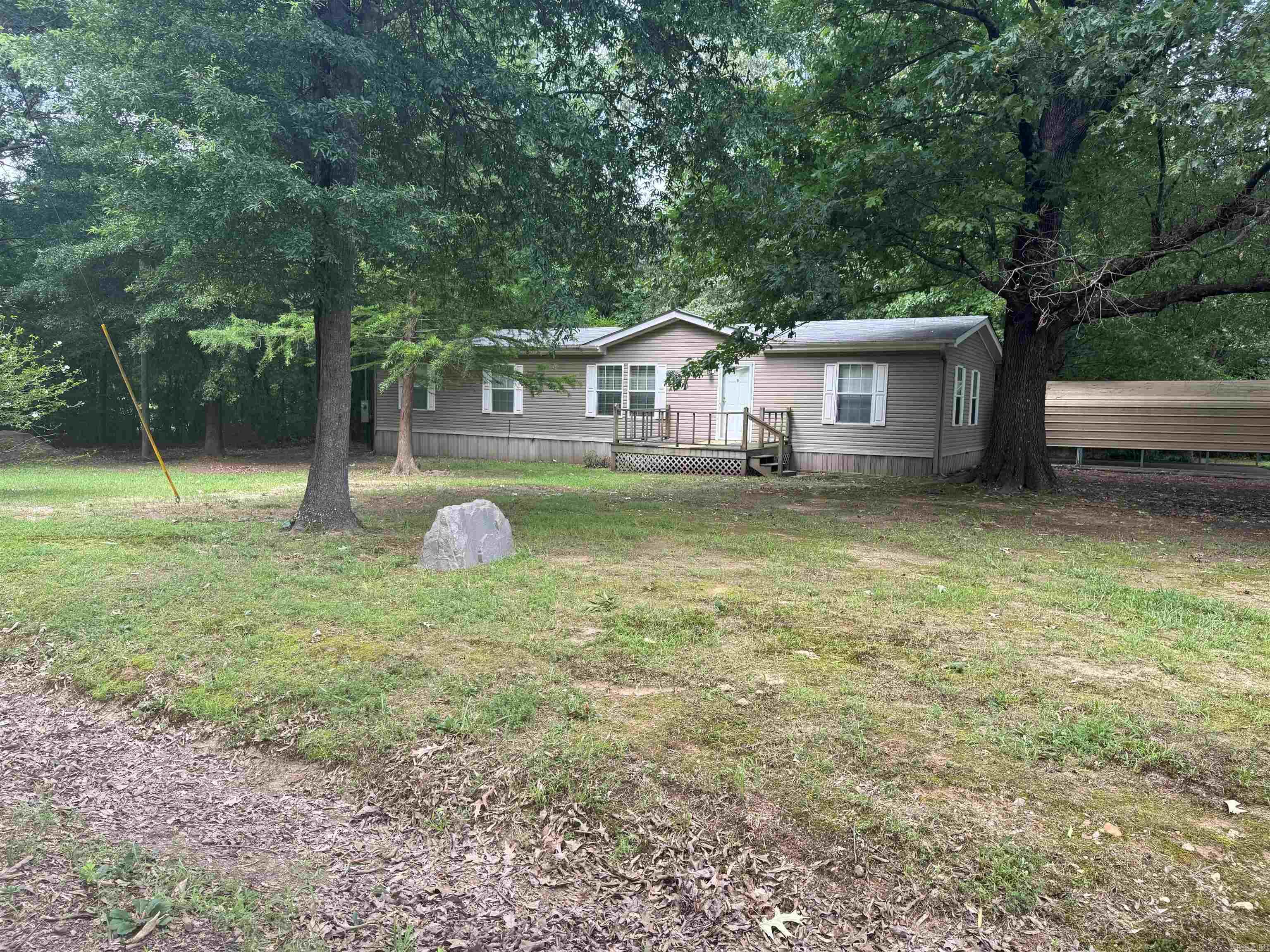 Fantastic double wide with spacious interior. Open concept, 3 bedrooms with primary that has an additional space that could be utilized as a nursery, sitting room or office. Large walk-in closet and bathroom with separate soaker tub and shower. Over 2 acres of land that is just as fabulous with outside storage and carports on the property. MUST SEE PROPERTY!