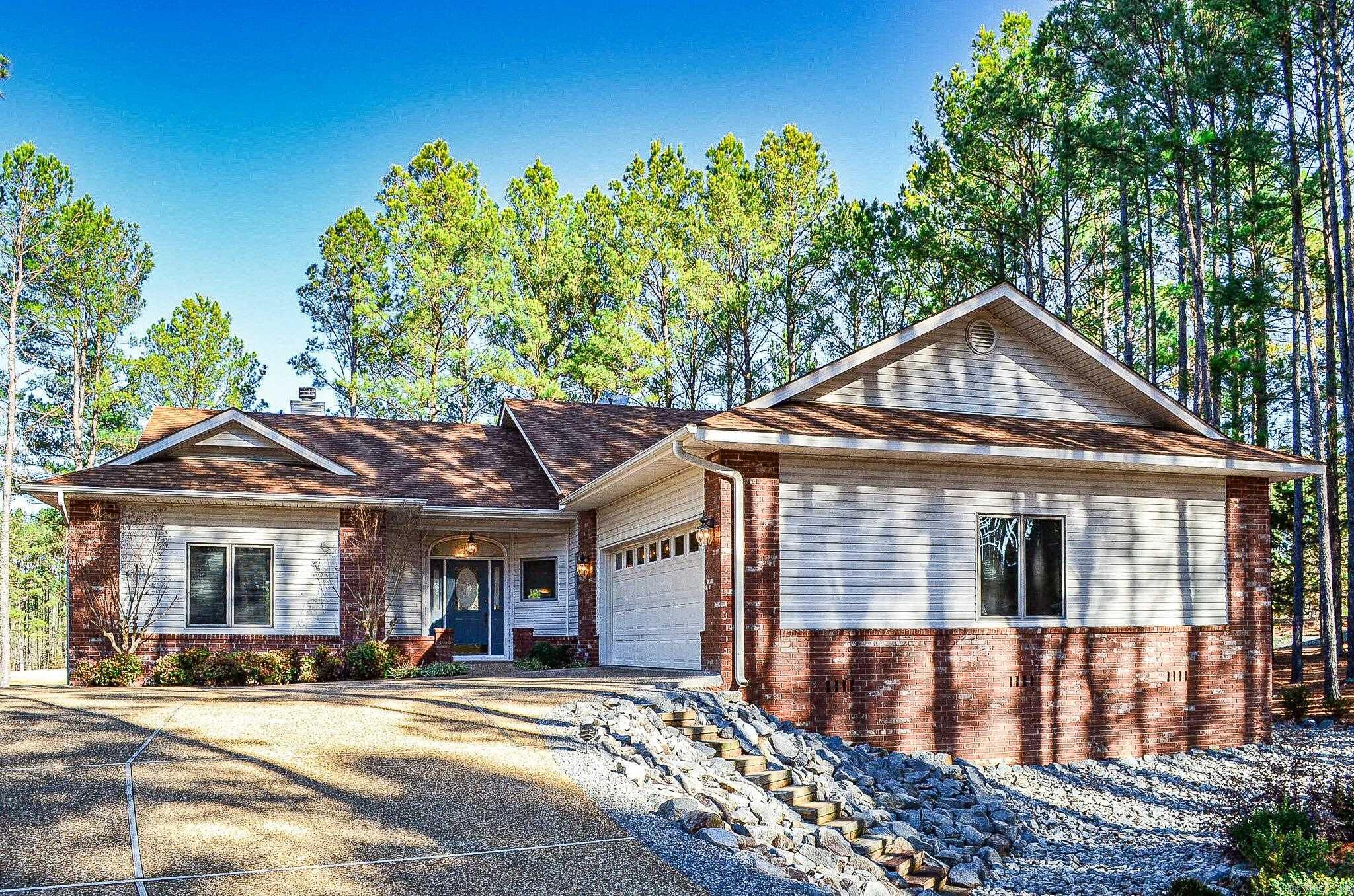 Great location and a beautiful home! The feel of privacy, yet the convenience of amenities and proximity to the East Gate. Over an acre of beautifully landscaped property on the #2 green of Nina on the Isabella Golf Course. This original-owner home has plenty of room for family living and entertaining! The open plan living/dining area has a gas fireplace with built-ins and a great view overlooking the golf course. The kitchen and laundry room are spacious and the refrigerator (2022), washer and dryer (2020) all stay. Bosch dishwasher (2022). The extra-large ensuite primary bedroom, a guest-room, office/bonus room and 2nd full bath are located on the main level with an additional living area, bedroom and full bath in the finished walkout basement.  Enjoy outdoor relaxing or entertaining on the main level composite deck with retractable awning or the covered lower-level patio. Storage galore: extra closets, deep garage with shelving, floored attic space and more storage in the crawl space, which has moisture barrier in place. Shield Radiant Barrier has been added in attic for added energy efficiency. Don't let this opportunity pass you by! SEE AGENT REMARKS