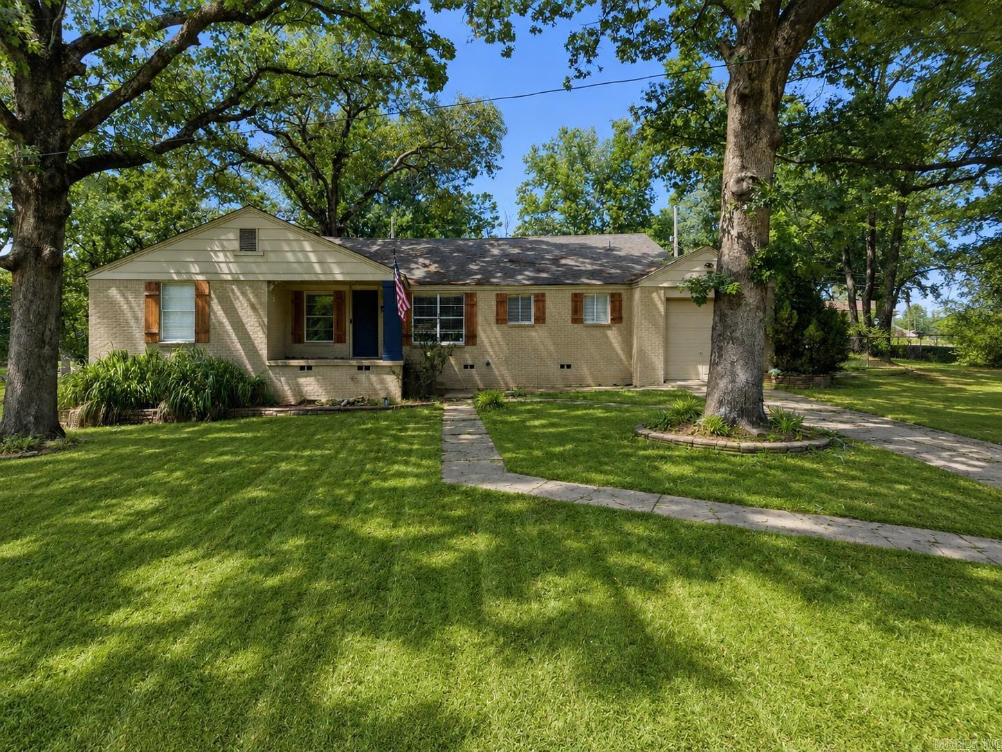 Welcome home to this charming home in the historic Park Hill area situated on a spacious ½+ acre corner lot! This move-in ready property offers 3 bedrooms, 2 full bathrooms, and a large family room featuring beautiful wood beam details. A versatile flex space provides the option for a 4th bedroom, home office, or playroom. The spacious kitchen includes stainless steel appliances and a comfortable breakfast area, perfect for everyday living. Recent updates include newer laminate flooring, fresh paint in select areas, updated shutters and more! Step outside to enjoy a huge backyard with an inviting patio, ideal for entertaining, relaxing, or outdoor activities. The property also features a one-car attached garage and sits on a quiet, low-traffic street, offering a peaceful setting within the desirable Park Hill neighborhood. A wonderful opportunity to own a character-filled home with space, updates, and charm in a fantastic location! Schedule your showing today!