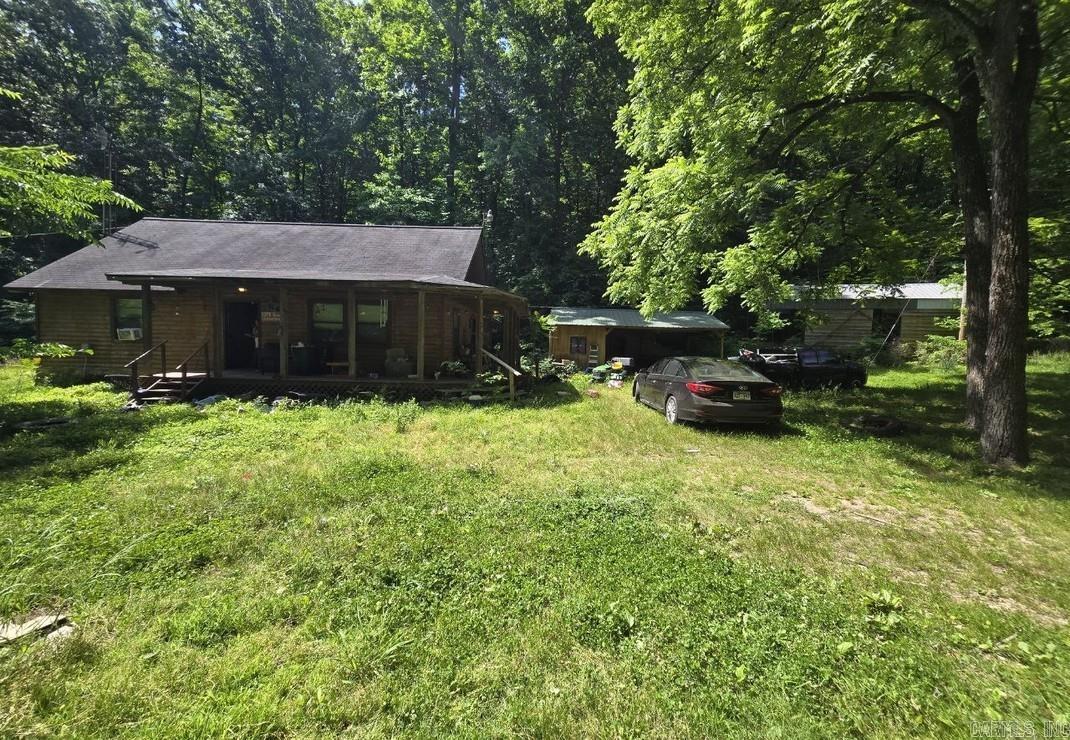 Escape to the folk music capital of the world with this charming log cabin built in 2010, perfectly nestled on 10 acres of serene Ozark privacy. Boasting 2 bedrooms and 1.5 baths, this property features exceptionally solid bones and is just waiting for a little TLC to truly shine. It is the ultimate canvas for a weekend getaway, located just minutes from the vibrant live music of the Mountain View Courthouse Square, the scenic hiking trails of the Ozark National Forest, and world-class trout fishing on the White River. Whether you want to explore Blanchard Springs Caverns or unwind in nature, this property is being sold completely as-is, offering the rare freedom to bring your own ideas and make it completely your own.