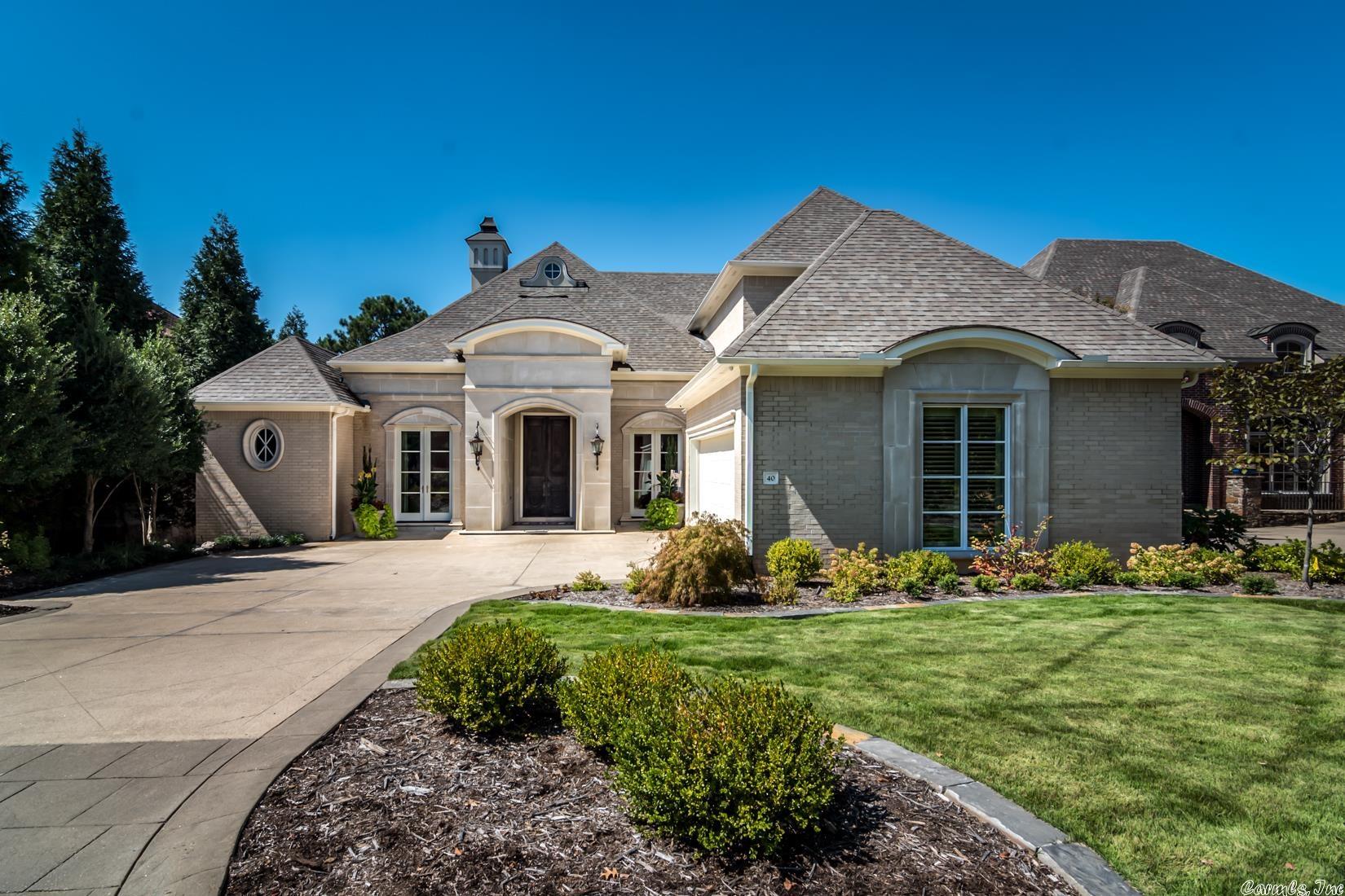 Exquisite home featuring timeless architecture located in the gated community of The Arbors, a short walk to Chenal Valley Country Club with stunning views of the golf course. The entry opens to 14ft ceilings featuring beautiful open, light filled spaces w/ sophisticated finishes. The dining room is open to the great room flowing into the den and chef's kitchen. A luxury master suite + guest suite are on the main level. Upstairs offers 2 bedrooms w/ ensuite baths and a den. Two car + golf cart garage.