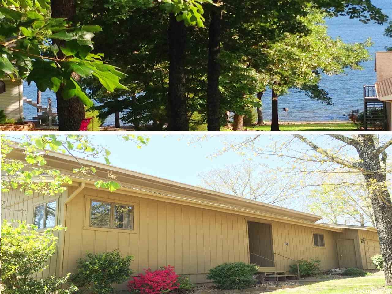 LAKE OMAHA VIEWS! PRIVACY! Charming 2567 sq ft home- very unique with unlimited potential sitting on 2 big lots! Open floor plan, high vaulted ceilings, central heat & air, native stone wood burning fireplace upstairs, large kitchen with all appliances included, large pantry, loads of cabinets, goes right out to big screened-in porch! 2 roomy bedrooms upstairs, 2 baths upstairs! Lower level has great family room, huge laundry-sewing area, BIG inside workshop w/ h/a, large mechanical rm. 2-car garage. #1976