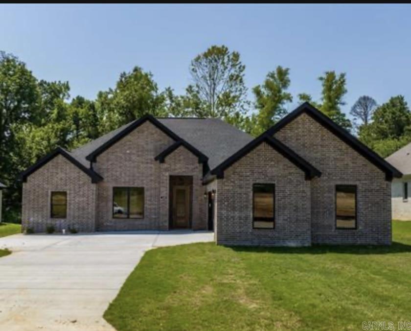Welcome Home to this beautiful new construction nestled in a new subdivision in the Harmony Grove area.  This home is close enough to all Benton has to offer.  Step through the front door to an open concept living room/kitchen area that's great for entertaining.  The dedicated office space is perfect for those who work from home but could be utilized as 4th bedroom.  This home features a split floor plan so the master suite has plenty of privacy with private access to the covered back patio.  The master bathroom is a private oasis with large walk in shower, gorgeous soaker tub, double vanities and a large walk in closet.  The guest rooms feature a shared jack and jill bathroom.  The laundry room offers plenty of space and a half bathroom is conveniently located near the common area.  Don't miss out on this one! Seller is offering $20,000 concessions with acceptable offer.