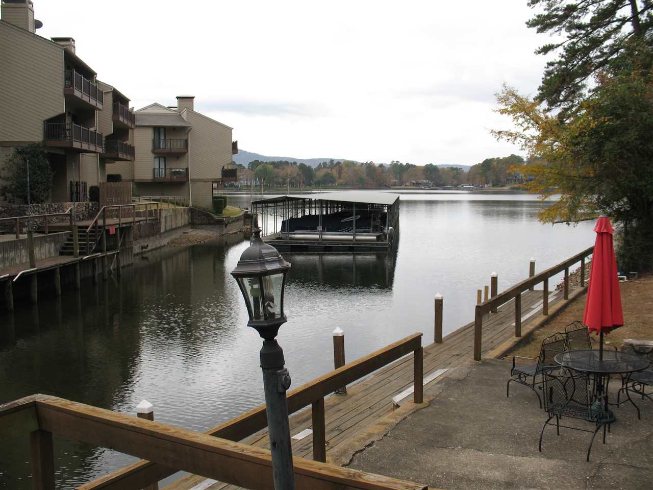 This LAKE FRONT CONDO on the main channel of Lake Hamilton has a beautiful Lake view from Deck. Master Bedroom and Living Room over look the Lake.  The $200.00 monthly HPR fee covers Grounds, Board Walk, Outside of Buildings, Roof, Termite Policy, Water, Sewer, Trash, Building Insurance.  Boat are allowed to be tied up along Board Walk.