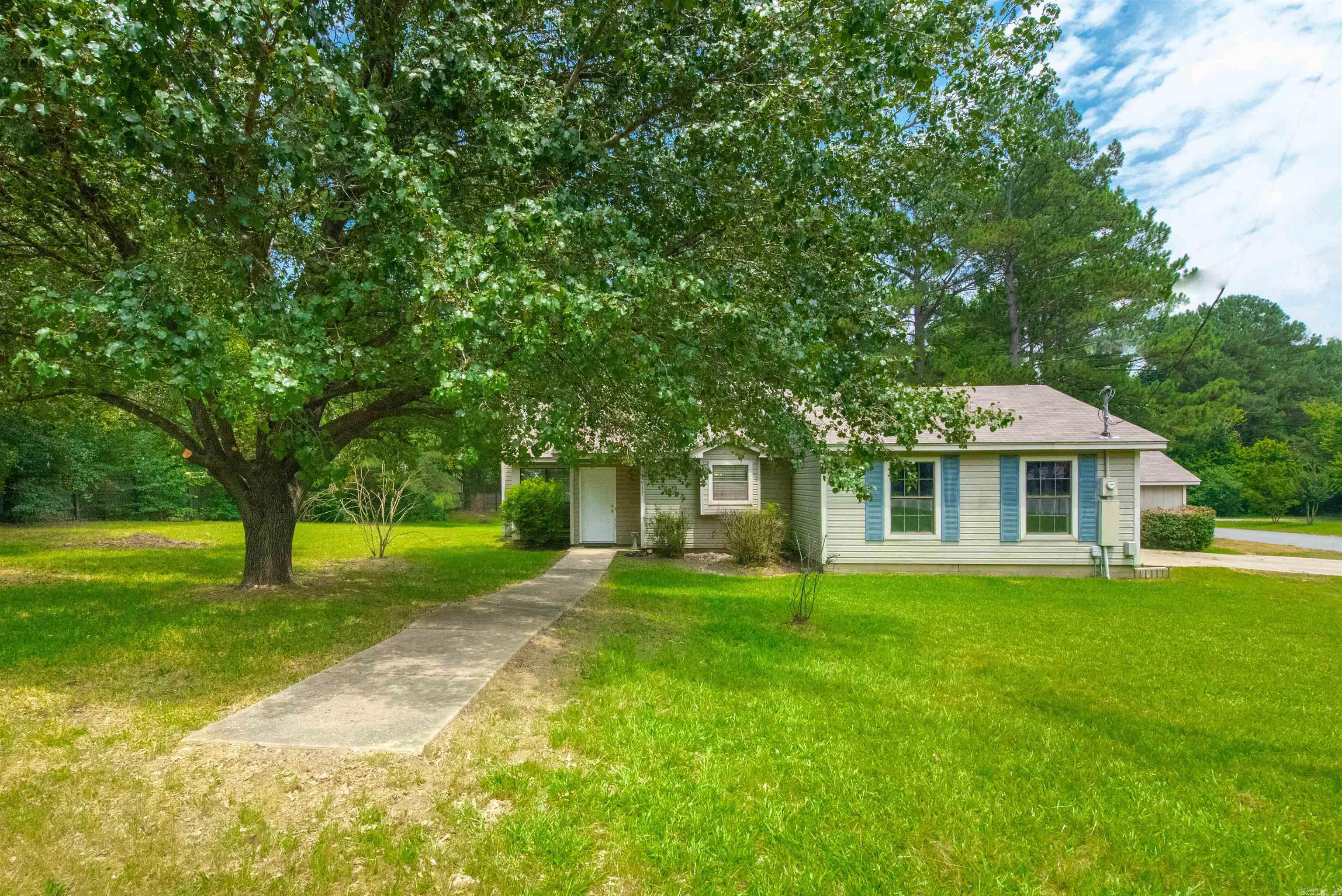 This beauty is ready to move into.  Freshly painted walls are a plus.  Open living, dining and partially to kitchen.  Large wood deck on the side.  The bonus is a huge 20x10 garage workshop detached from the home that doesn't detract from the attached two car garage.  House sits on a corner lot with some of the yard contained within a privacy fence.  Roof about 6 years old.  Property is located in the Rural Development area and may qualify for 100% financing.  Make your appointment today.