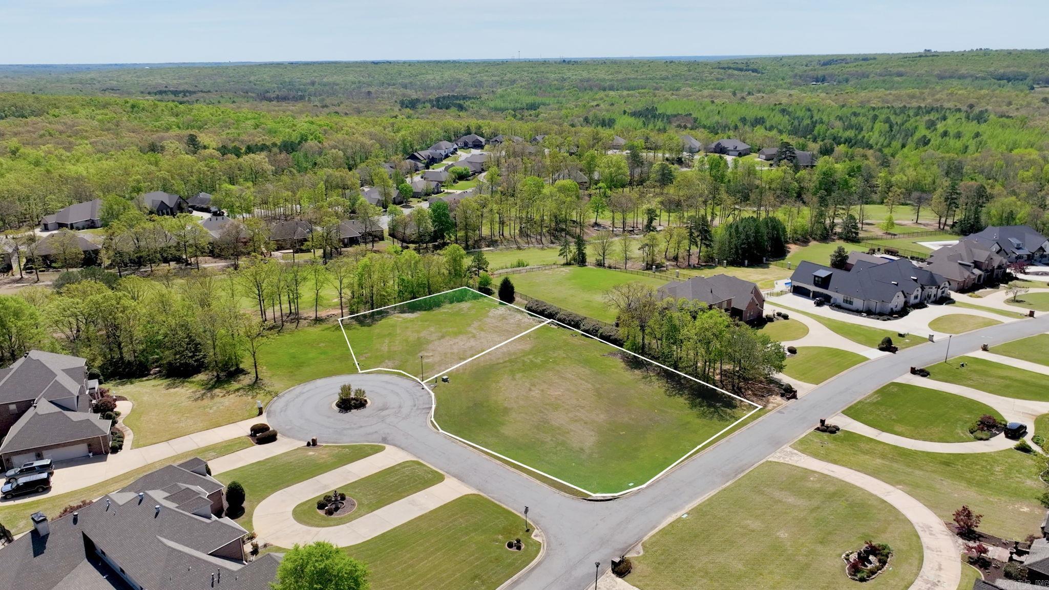 Positioned on a desirable corner lot (Lot 13 on Inverness Cove) and surrounded by million-dollar homes, this over ½-acre homesite offers a rare opportunity inside the gated Valhalla subdivision of Greystone in Cabot. With its prime location, this lot provides added space, flexibility, and curb appeal—perfect for designing a custom home that truly stands out. Enjoy the privacy and security of this prestigious community while embracing a lifestyle centered around luxury and convenience. Residents have access to premier amenities including a country club, resort-style pool, tennis and pickleball courts, on-site dining, and a beautifully maintained golf course. Opportunities in Valhalla are limited, as there are only 2 lots remaining. Lot 14 is also available—secure one or both and create your vision in one of Cabot’s most desirable communities.