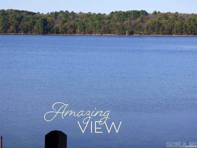 Looking for a Peaceful Sanctuary to Relax and Recharge?  Look no further!  The highly sought-after FARR SHORES Condo Complex offers so much...this completely updated 2 bed 2 bath provides an unparalleled waterfront living experience.  Sitting right on the waters edge and nestled in a shady tree lined neighborhood, with a swimming pool, all sports court (ready for tennis, pickle ball or pickup game of basketball) a boat ramp and boat trailer parking for your convenience.  Upon entering the condo, you are greeted with a beautiful kitchen that opens to the dining and living area for a seamless floor plan.  Looking right onto Lake Hamilton the 2 bedrooms offer comfort and privacy for both residents and guests. The primary boasts it's own en-suite and lake views.  Plus, there are 2 separate patios...one for the grilling chef and a large covered one for your outdoor pleasure.  Don't miss this opportunity to own a slice of heaven!   (STR allowed) COMES with a BOAT Slip and a Sea-Doo Lift!!!